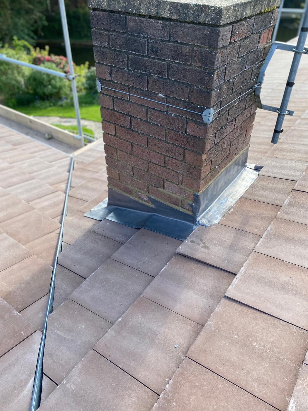 Professional roofers working on a property in London - KS Roof Master