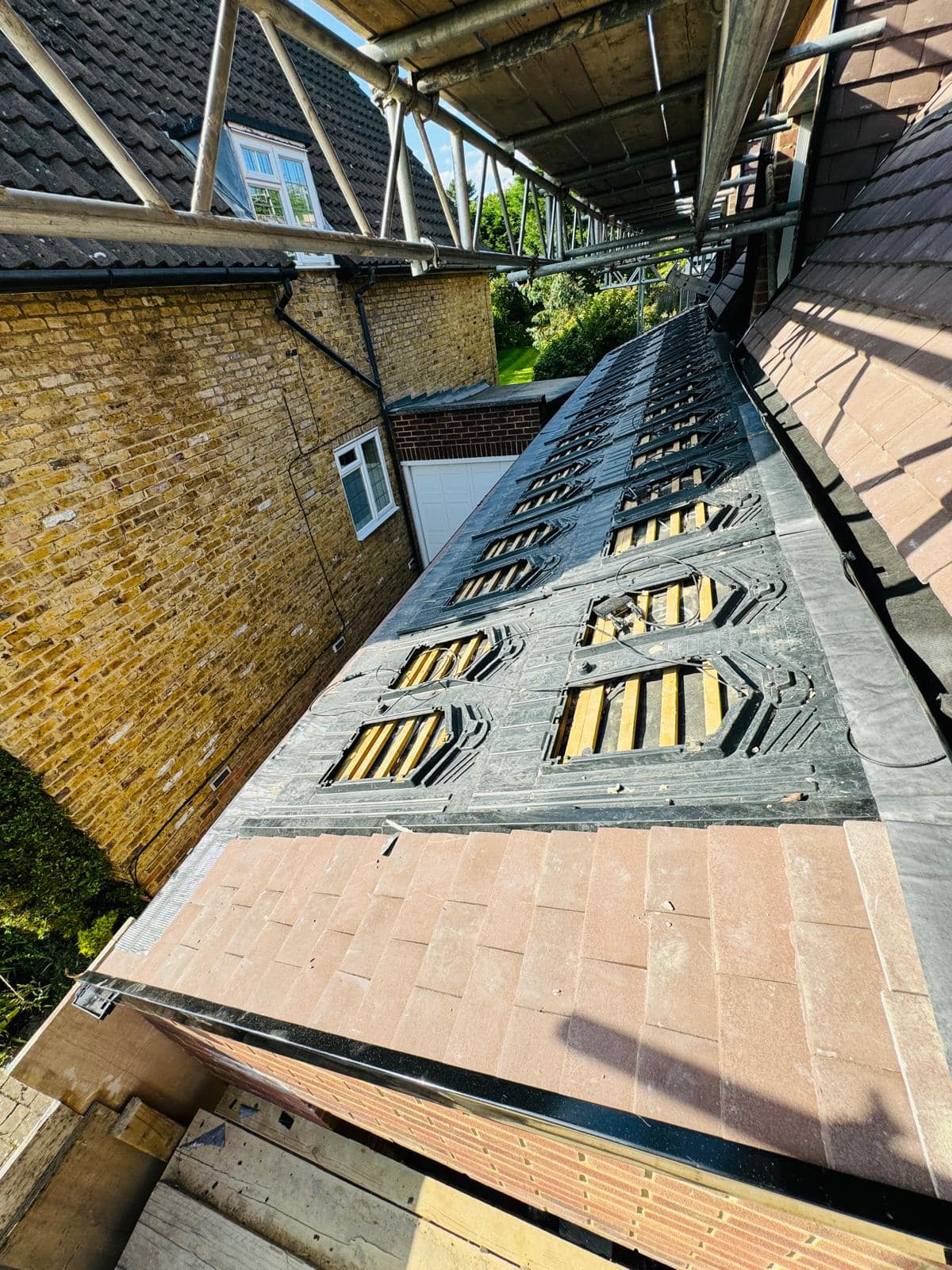 Professional roofers working on a property in London - KS Roof Master