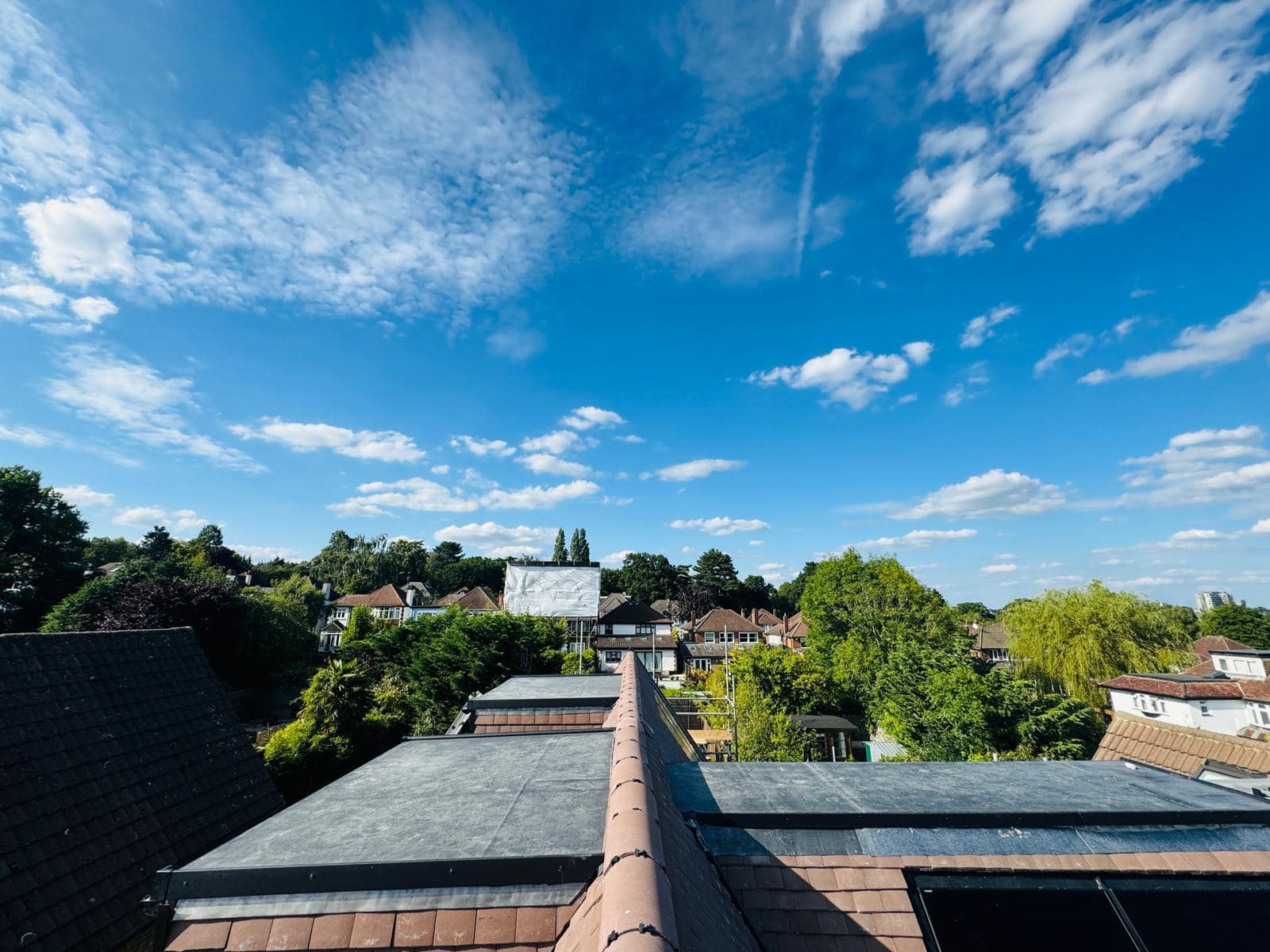 Professional roofers working on a property in London - KS Roof Master