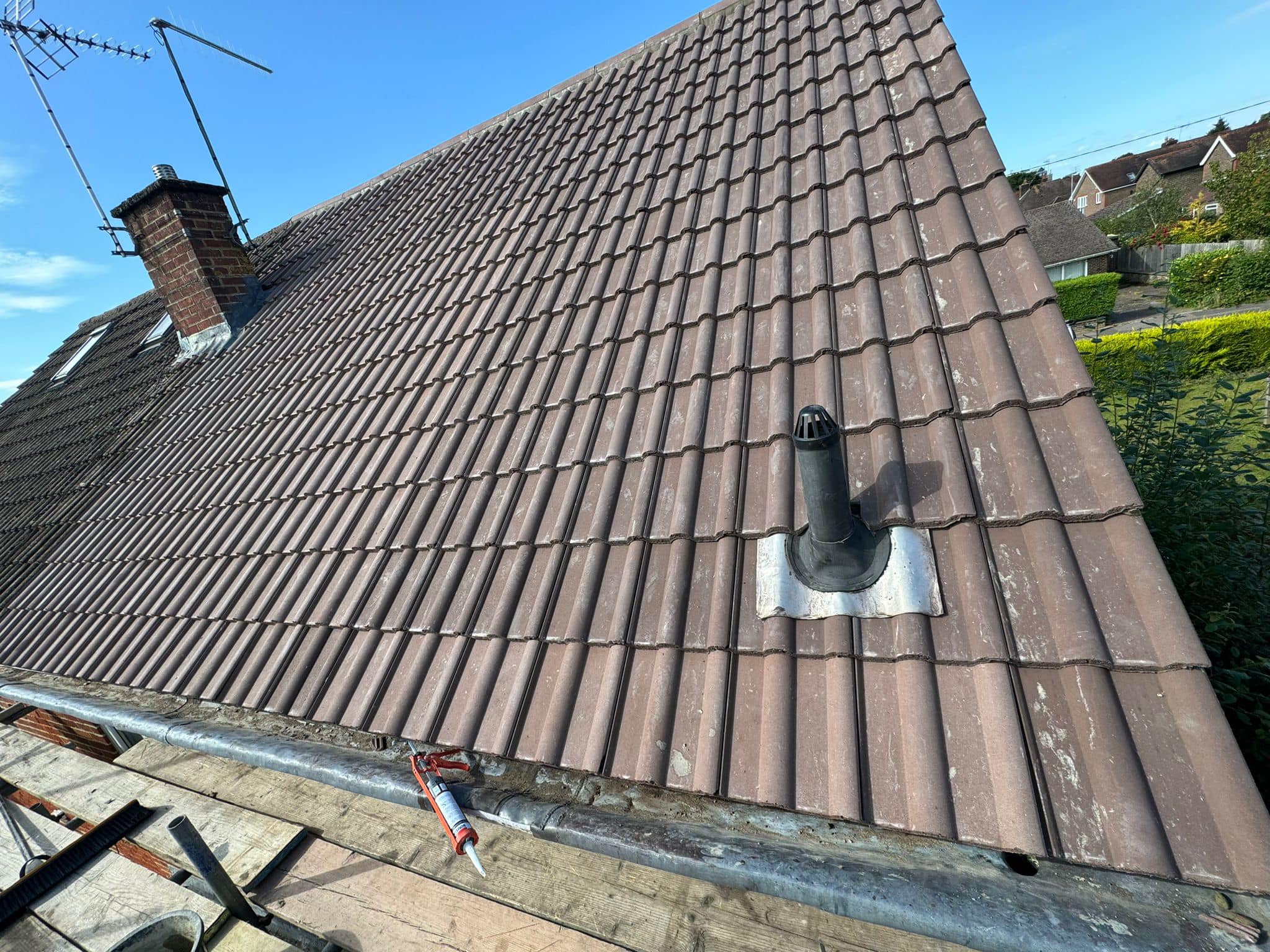 Professional roofers working on a property in London - KS Roof Master
