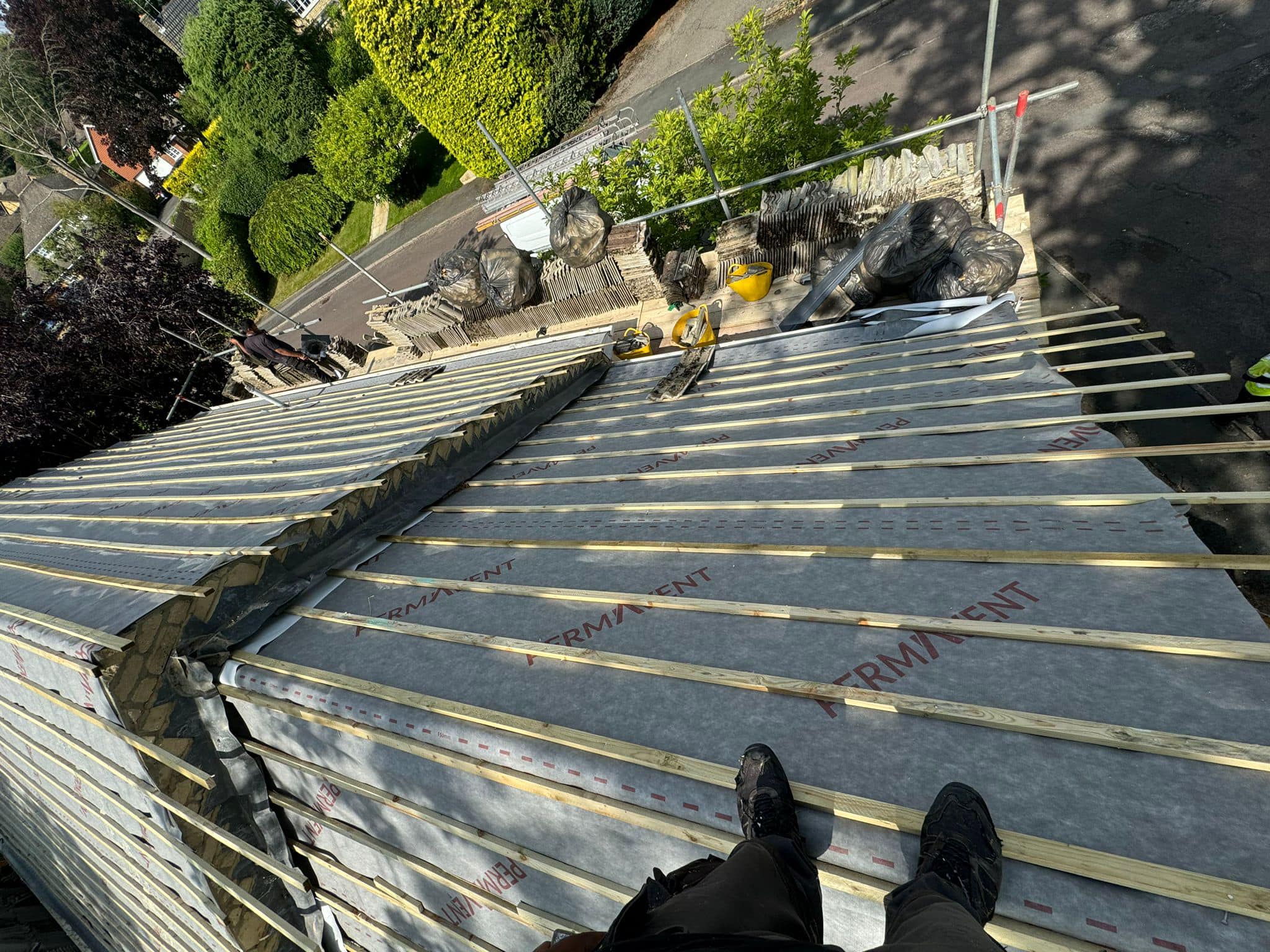 Professional roofers working on a property in London - KS Roof Master