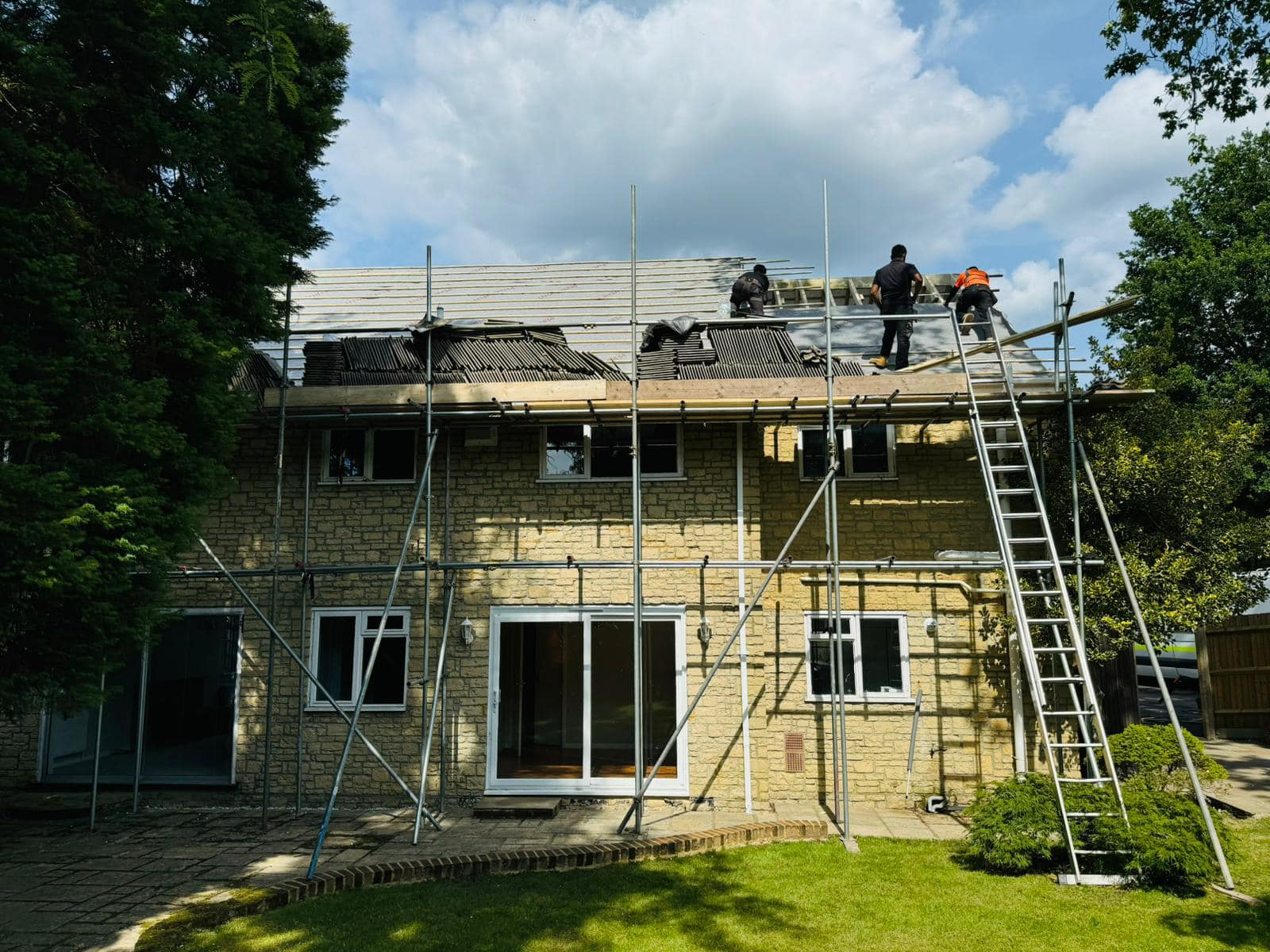 Professional roofers working on a property in London - KS Roof Master