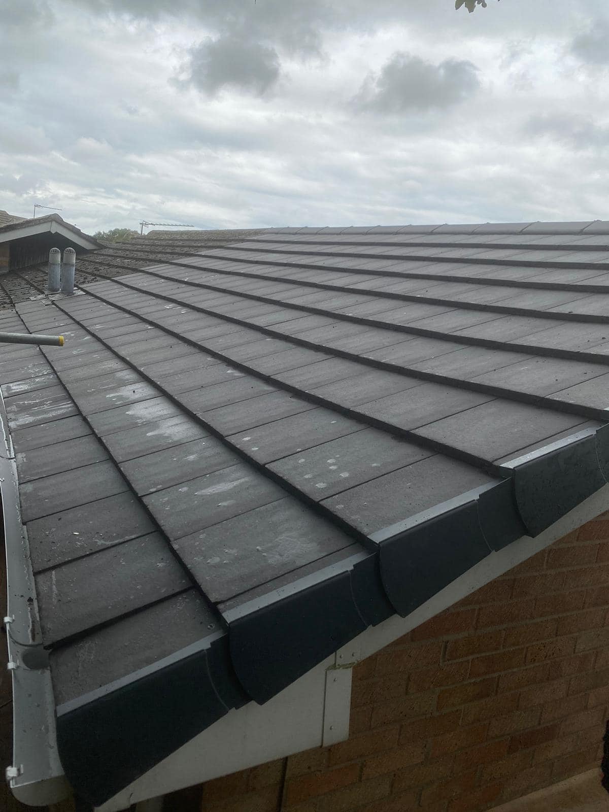 Professional roofers working on a property in London - KS Roof Master