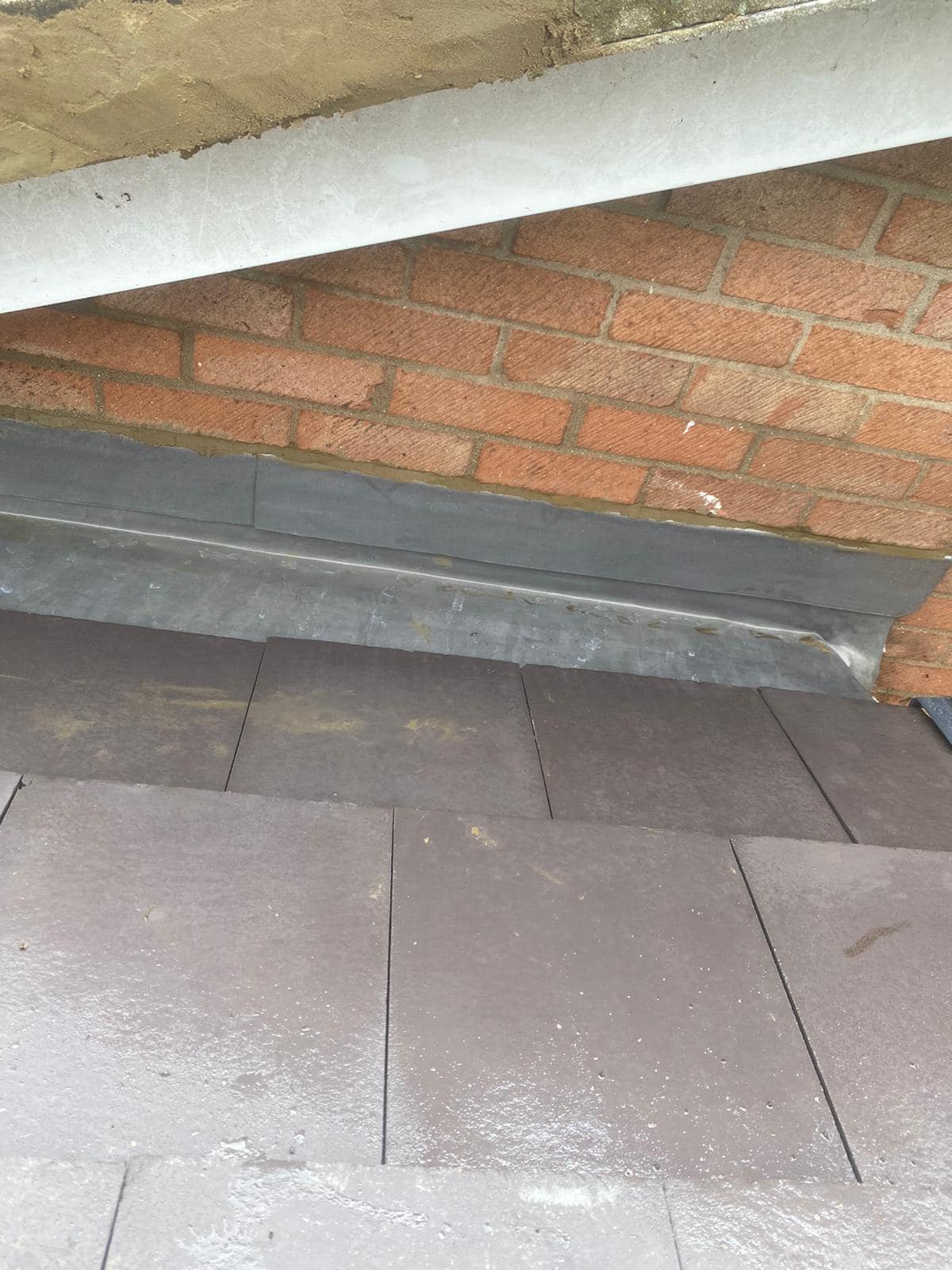 Professional roofers working on a property in London - KS Roof Master