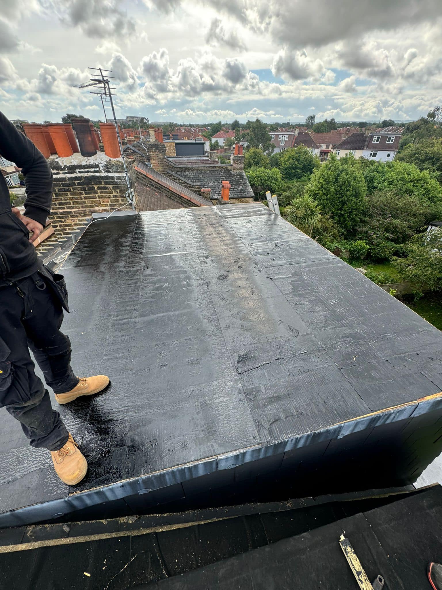 Professional roofers working on a property in London - KS Roof Master