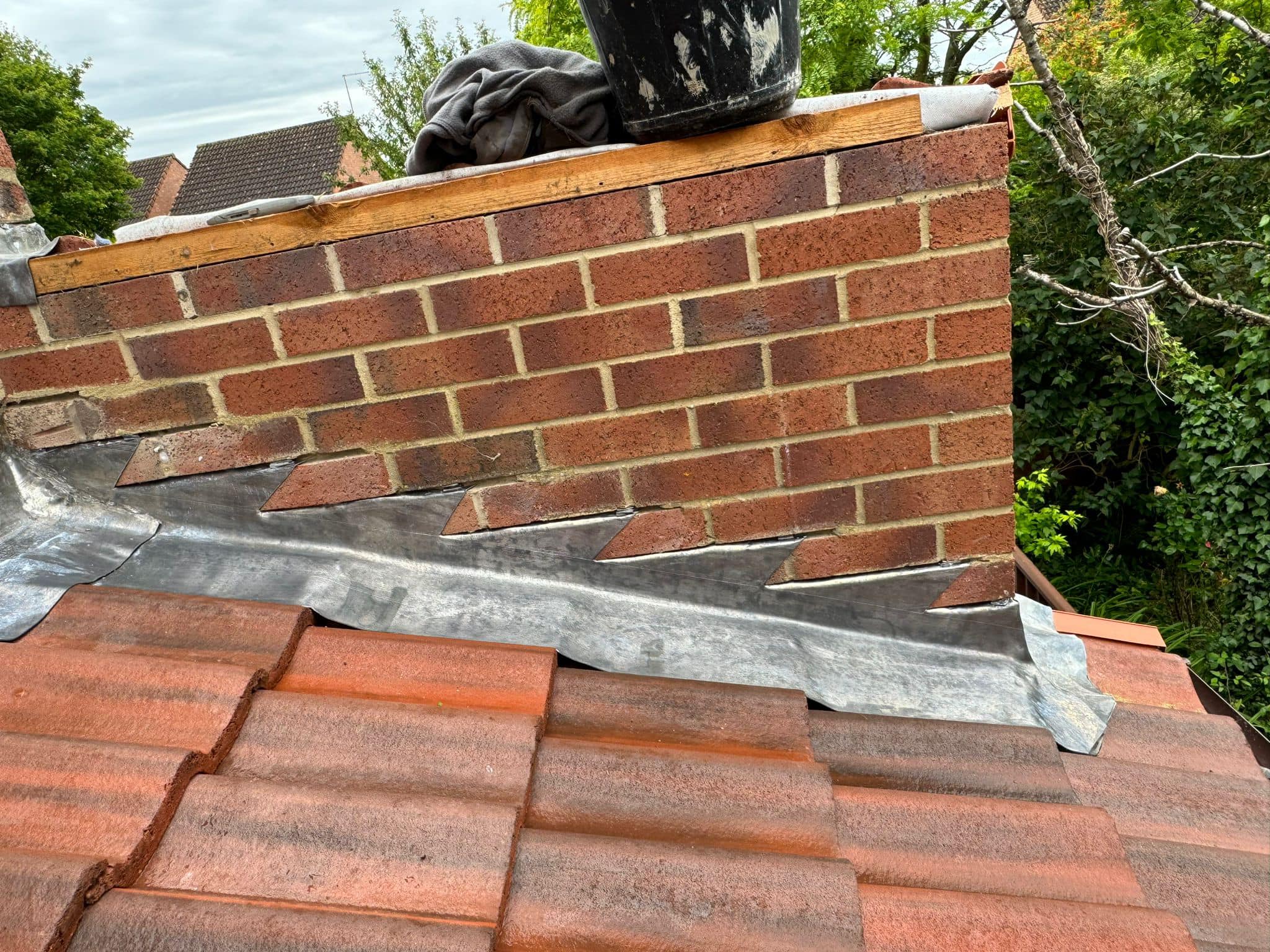Professional roofers working on a property in London - KS Roof Master