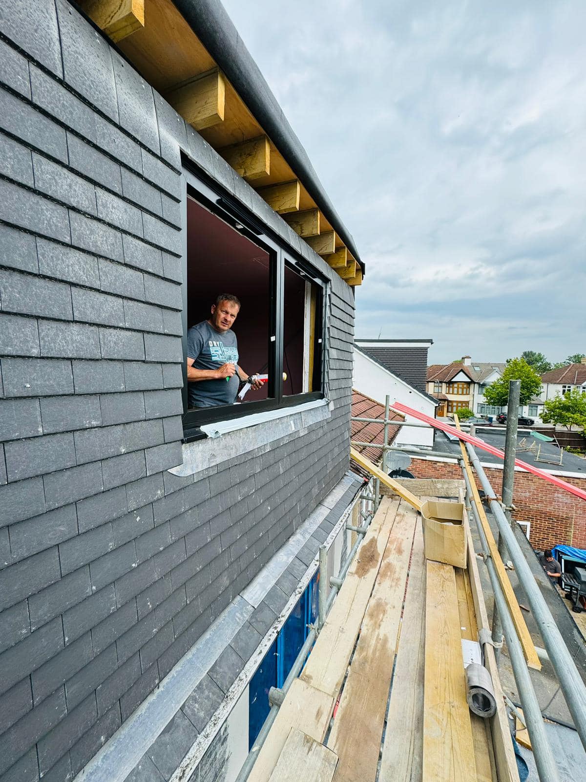 Professional roofers working on a property in London - KS Roof Master