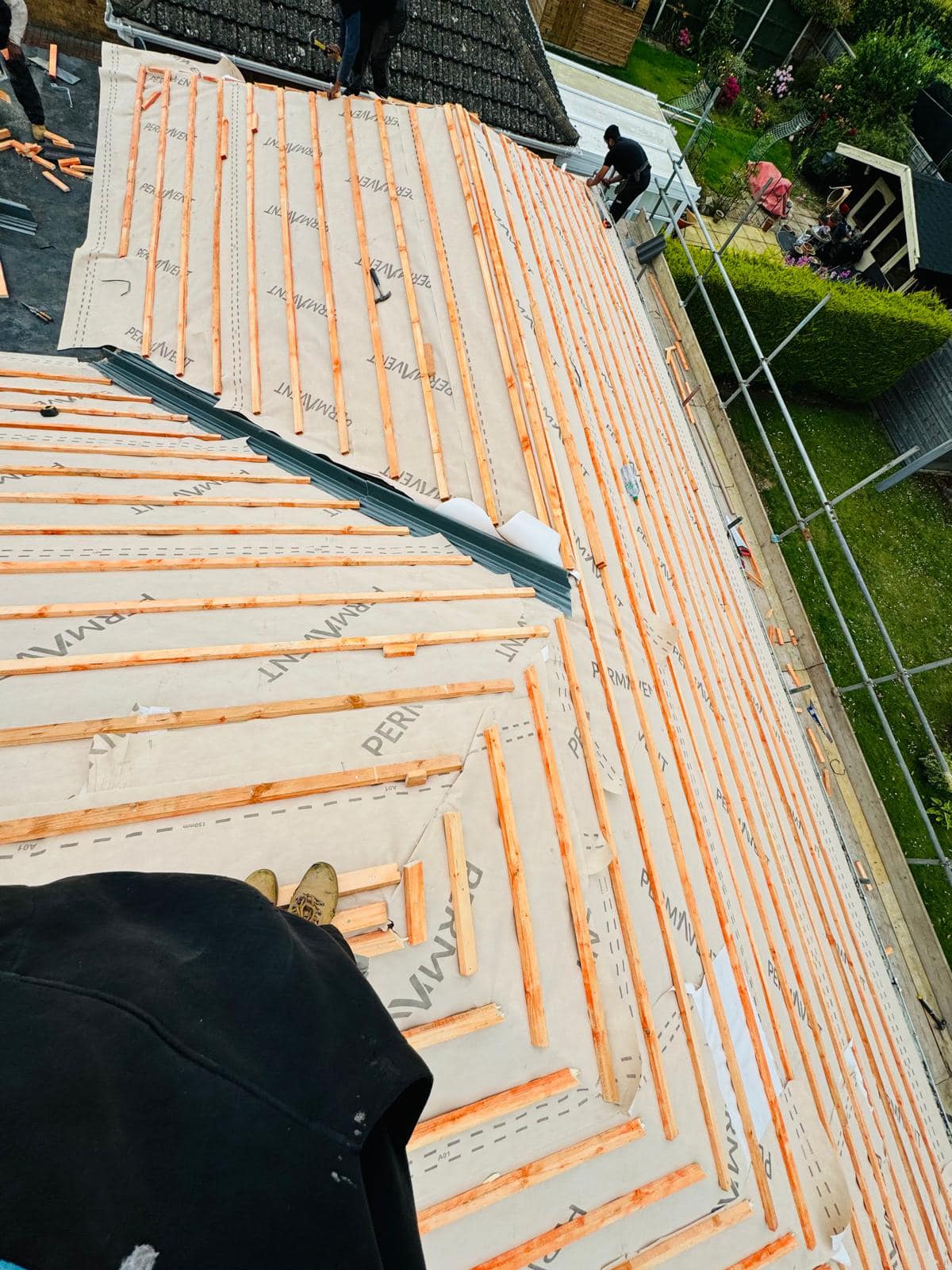 Professional roofers working on a property in London - KS Roof Master