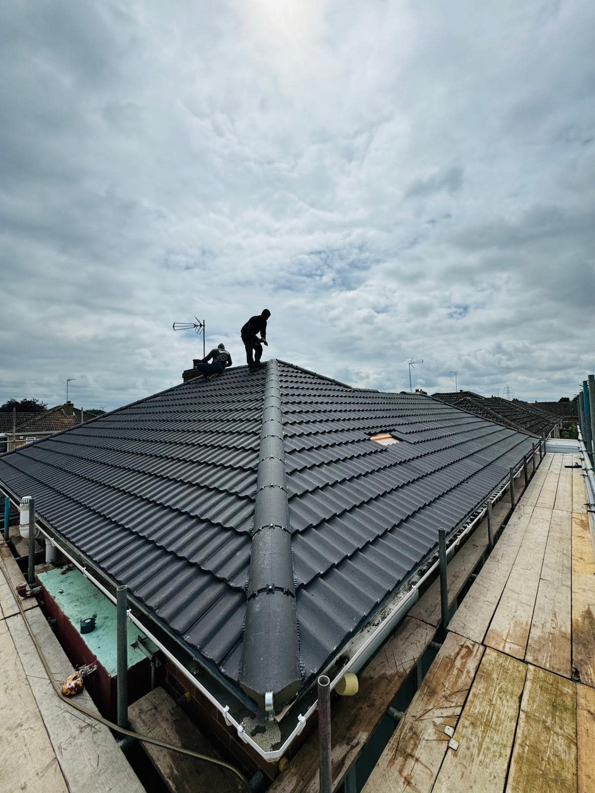 Professional roofers working on a property in London - KS Roof Master