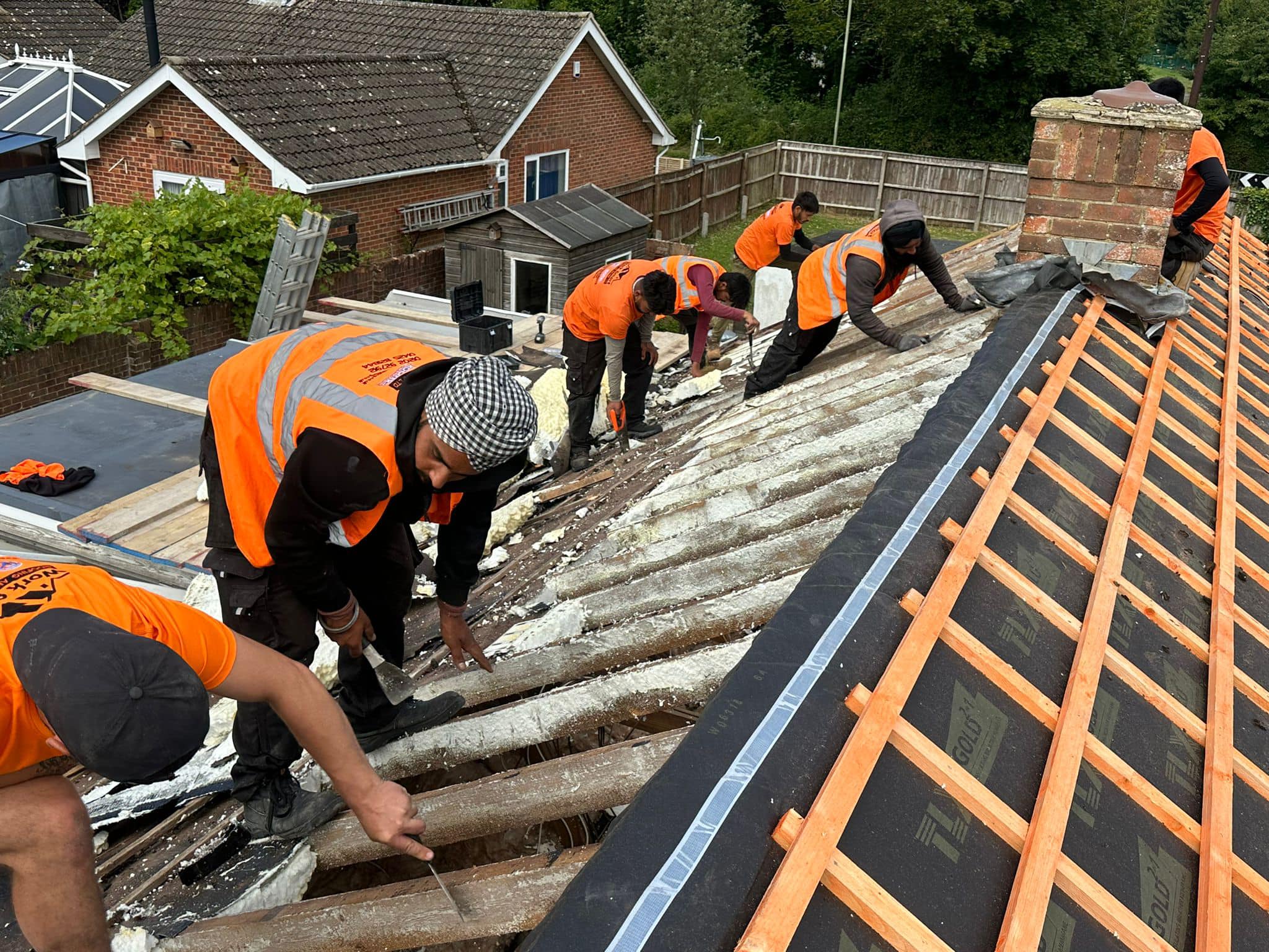 Professional roofers working on a property in London - KS Roof Master