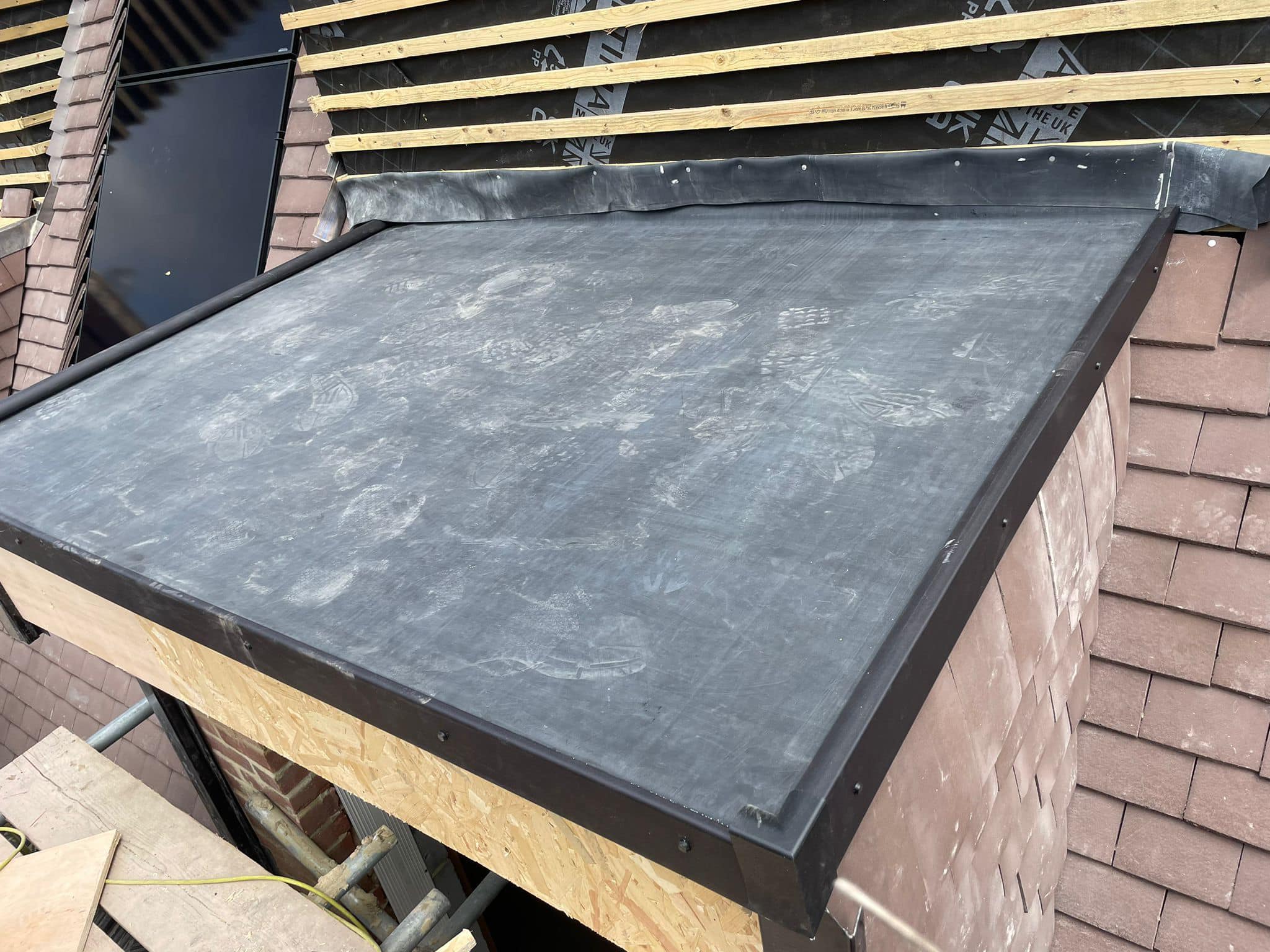 Professional roofers working on a property in London - KS Roof Master