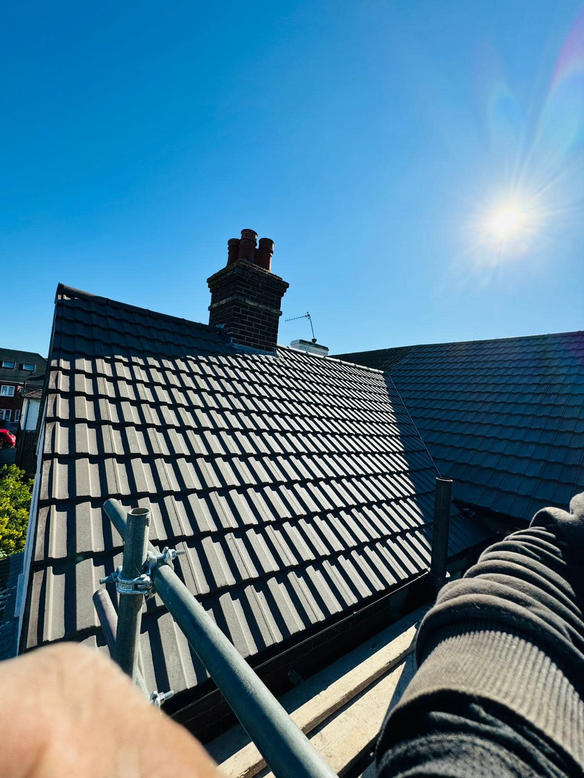 Professional roofers working on a property in London - KS Roof Master