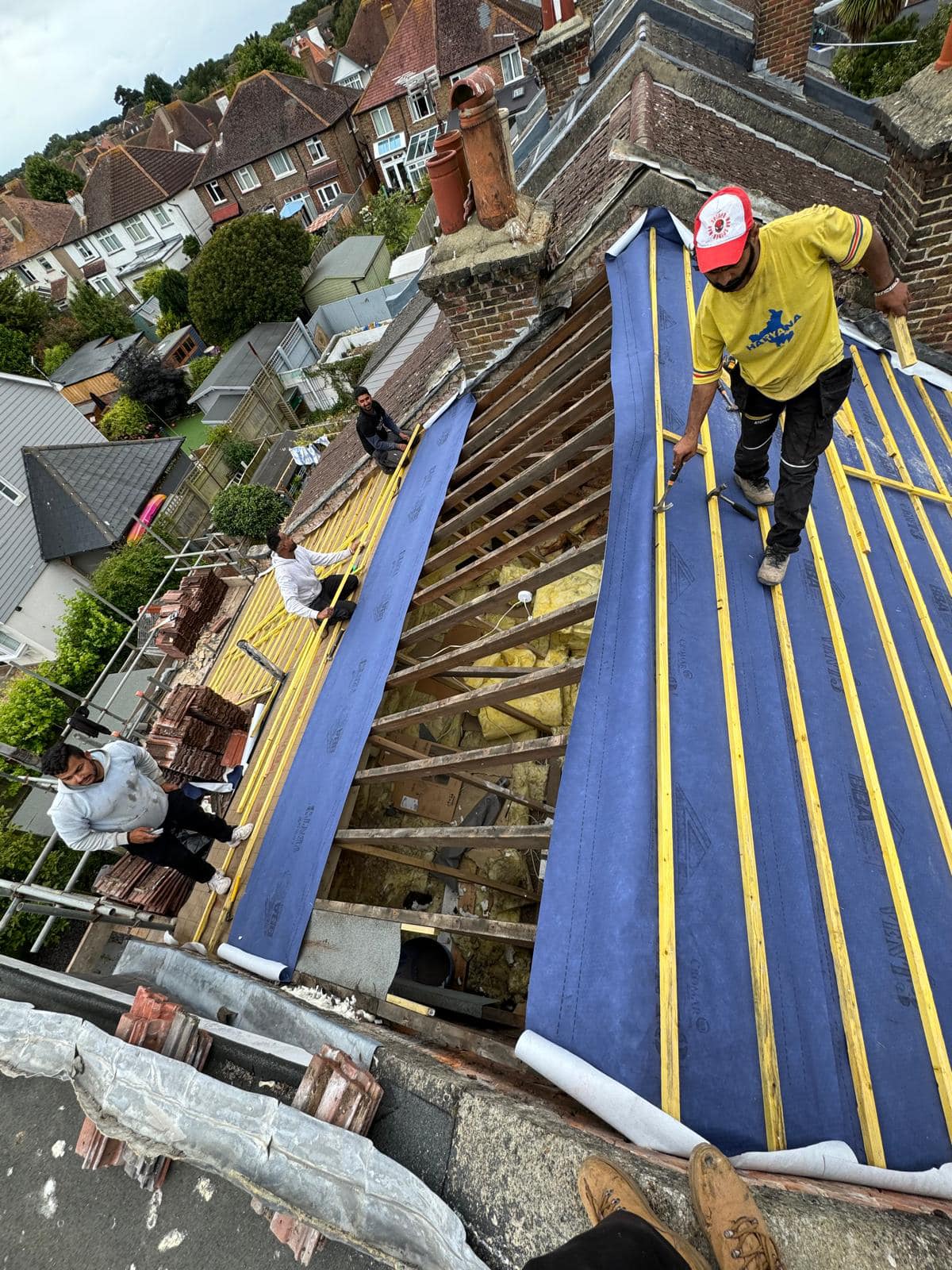 Professional roofers working on a property in London - KS Roof Master