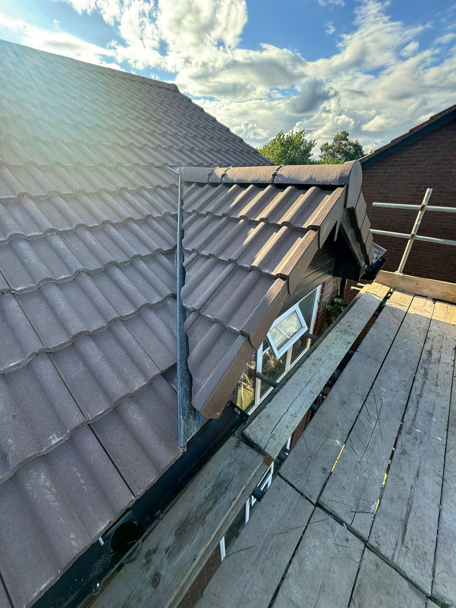 Professional roofers working on a property in London - KS Roof Master