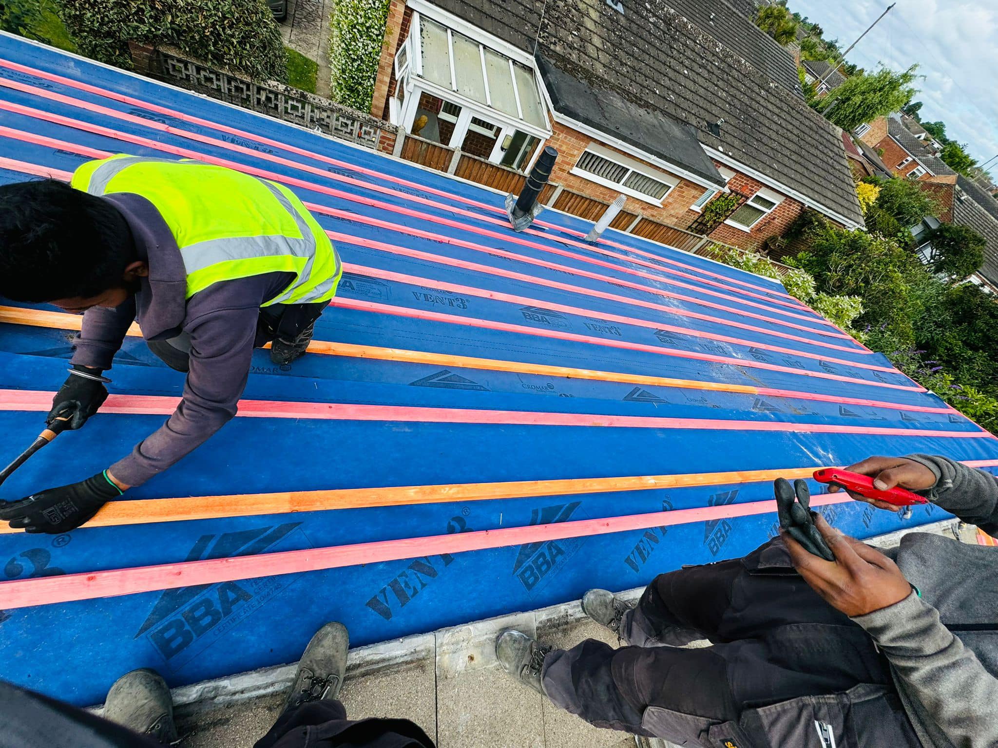 Professional roofers working on a property in London - KS Roof Master