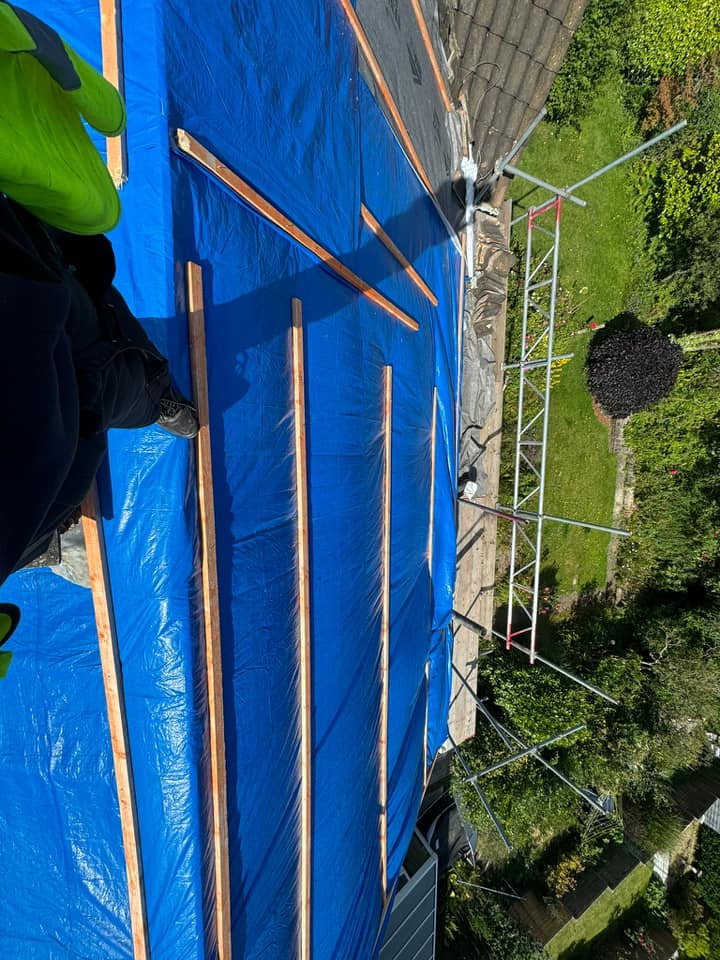 Professional roofers working on a property in London - KS Roof Master