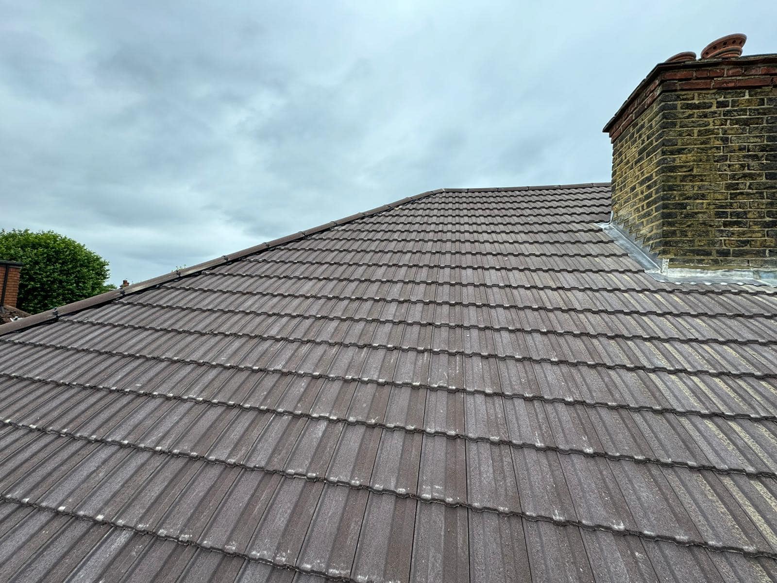 Professional roofers working on a property in London - KS Roof Master