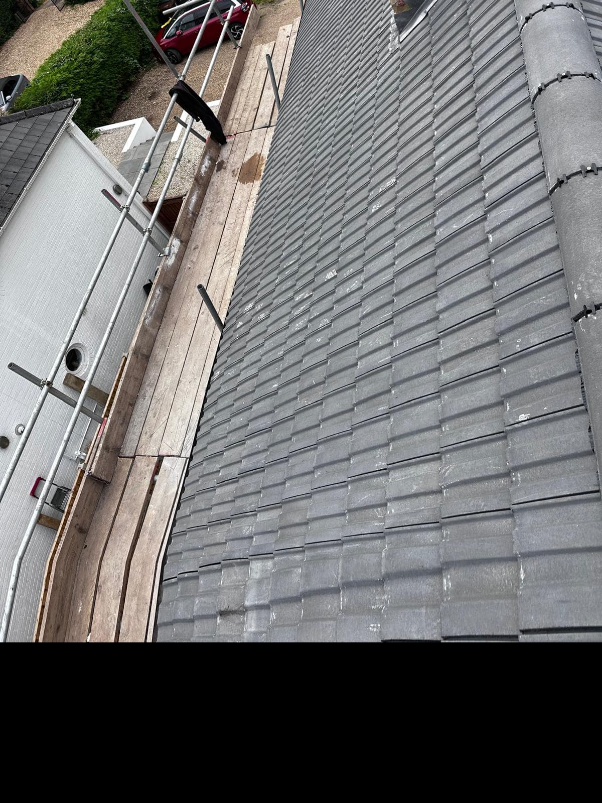Professional roofers working on a property in London - KS Roof Master
