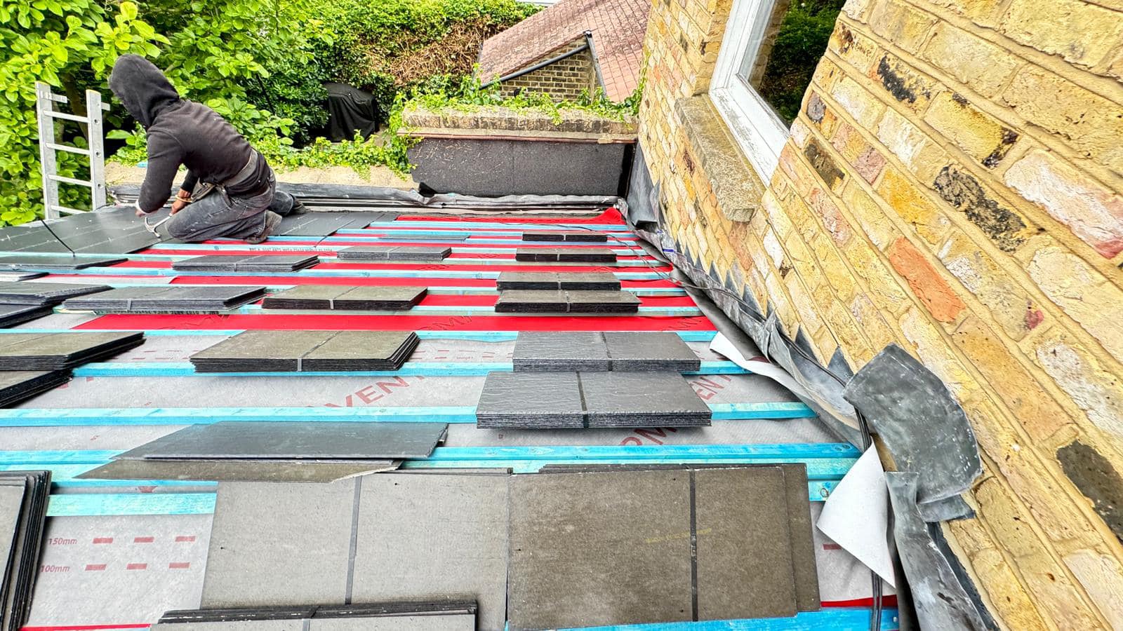 Professional roofers working on a property in London - KS Roof Master
