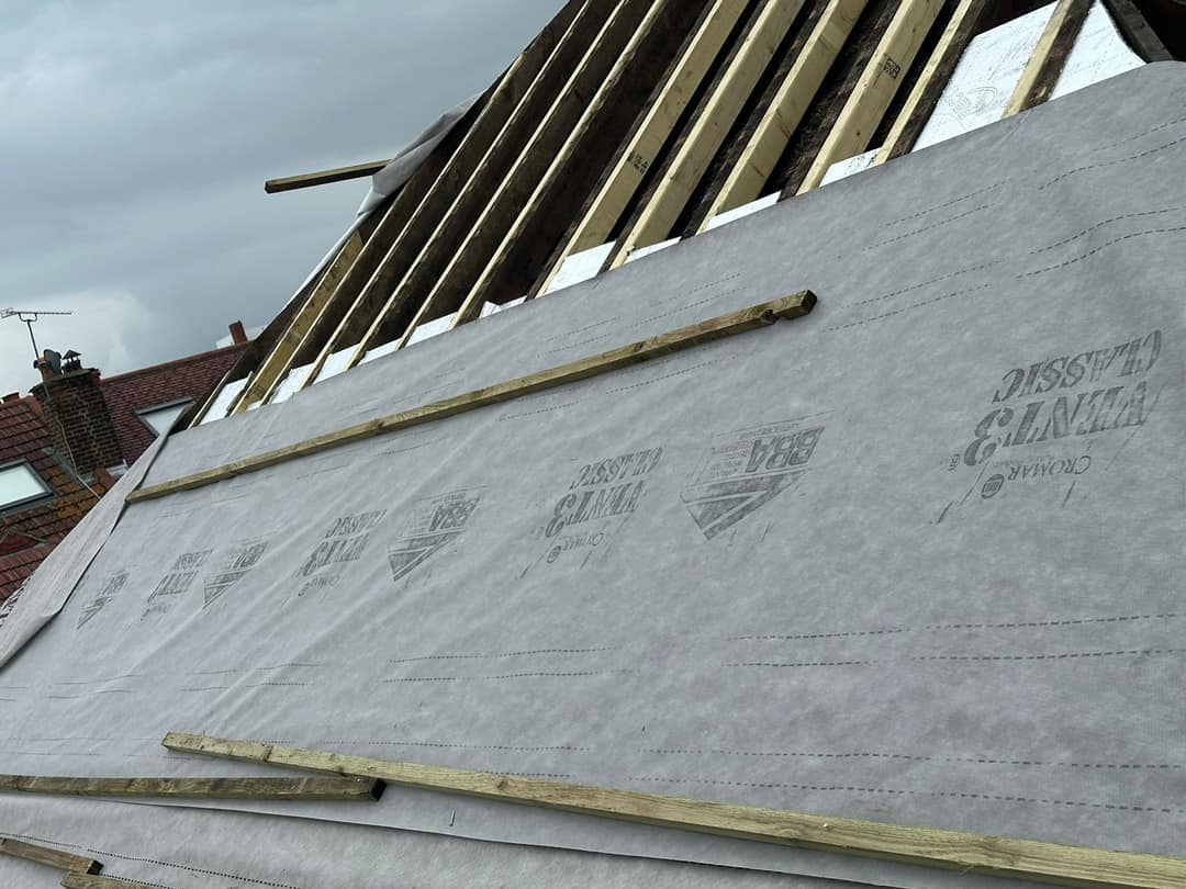 Professional roofers working on a property in London - KS Roof Master