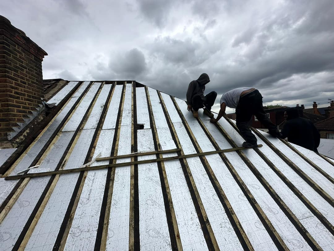 Professional roofers working on a property in London - KS Roof Master
