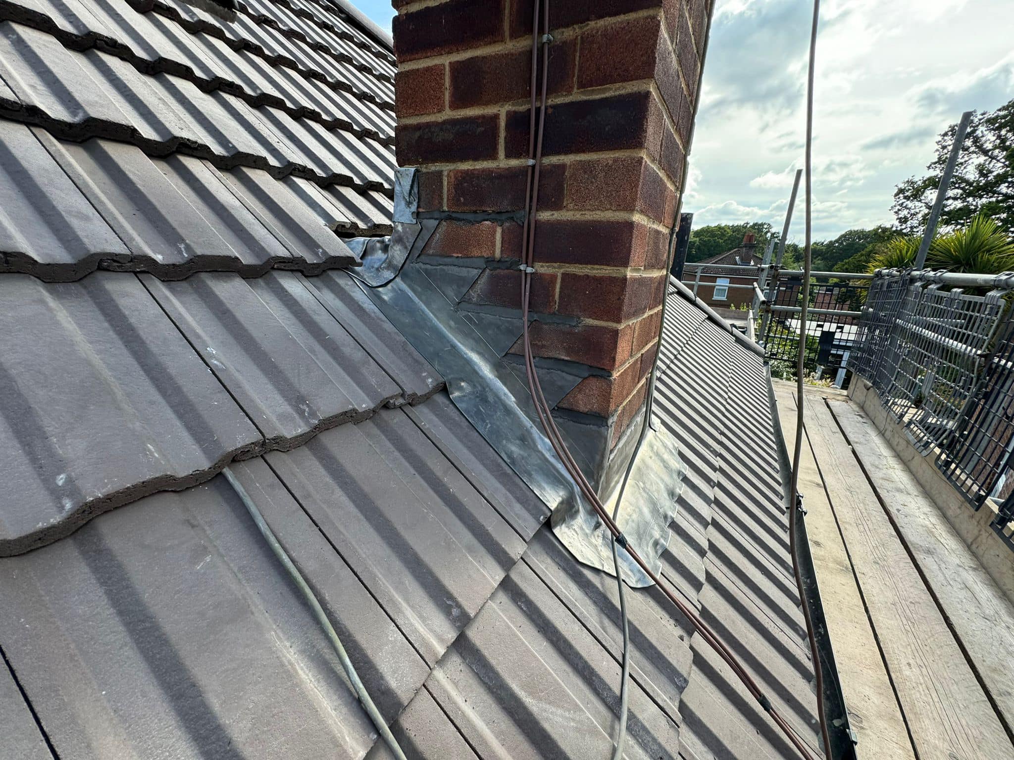 Professional roofers working on a property in London - KS Roof Master