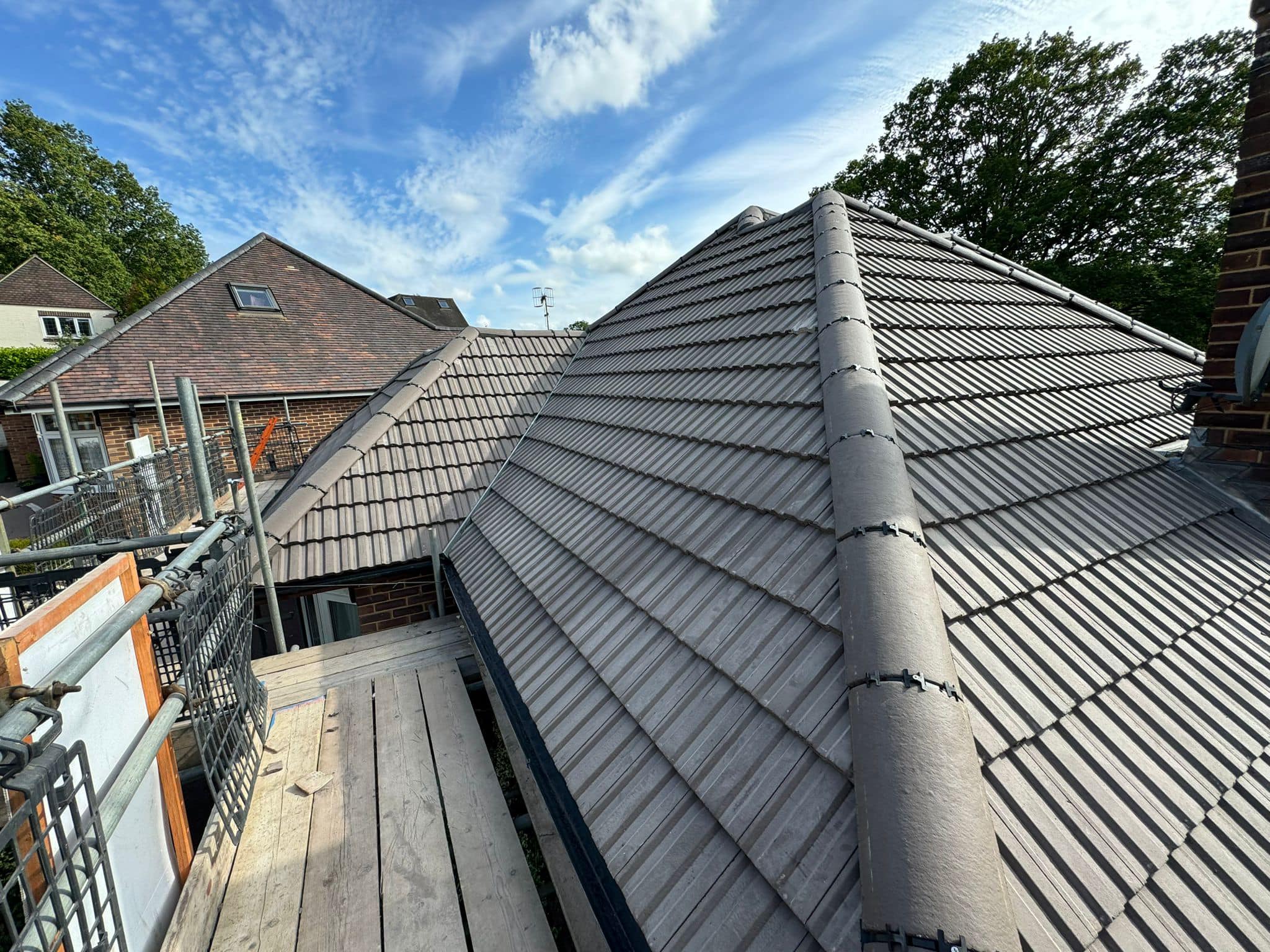 Professional roofers working on a property in London - KS Roof Master
