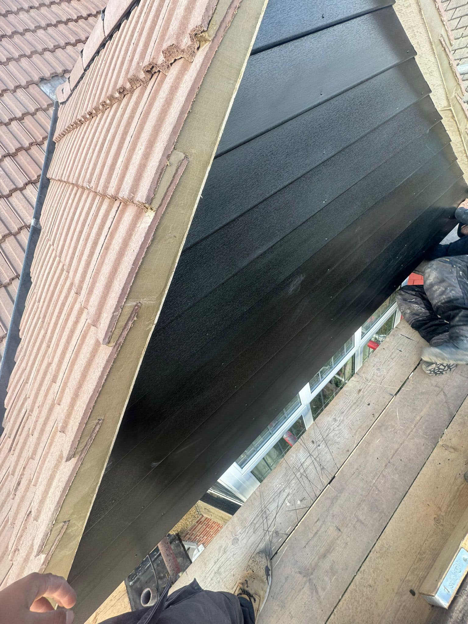 Professional roofers working on a property in London - KS Roof Master