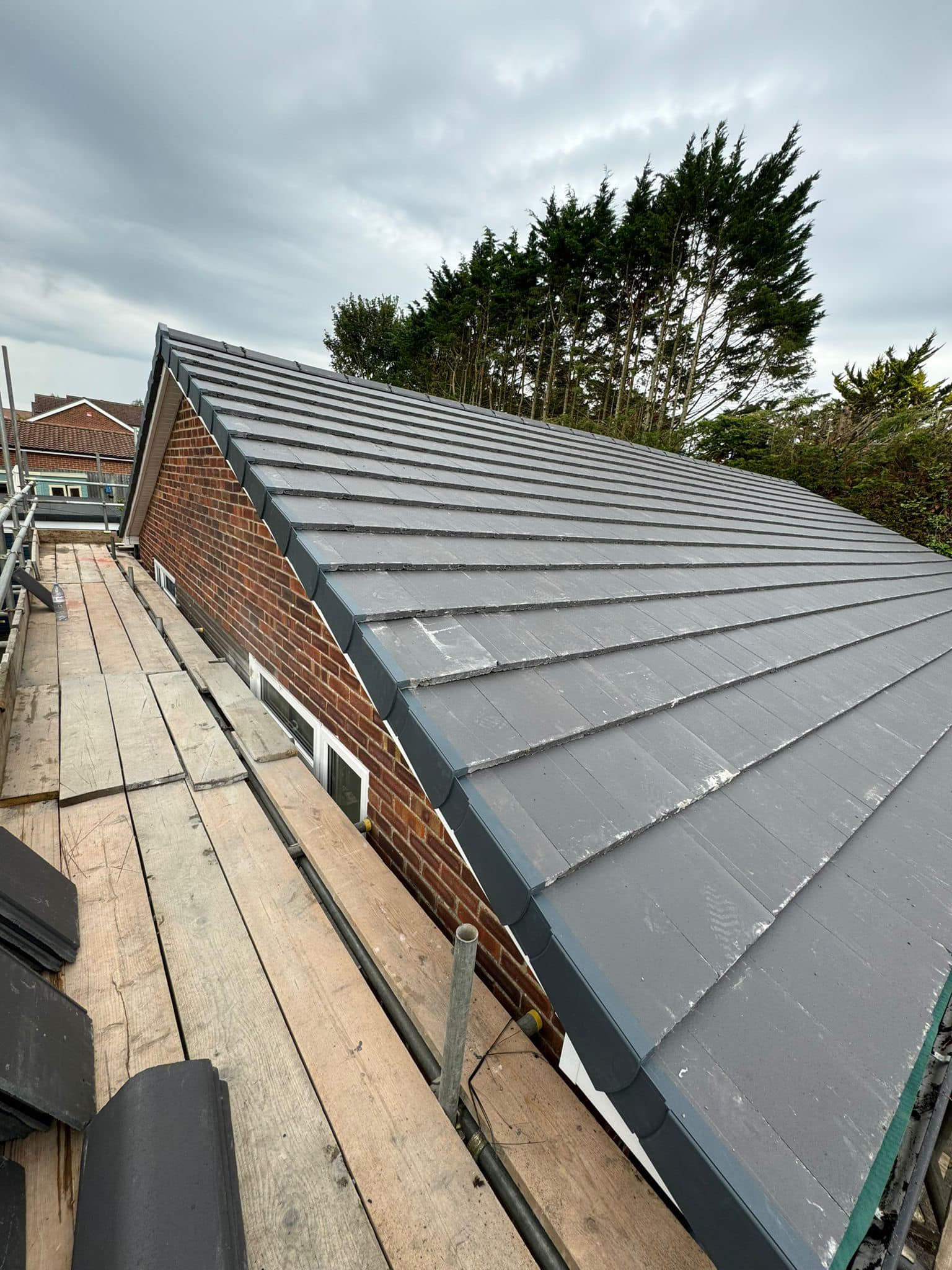 Professional roofers working on a property in London - KS Roof Master