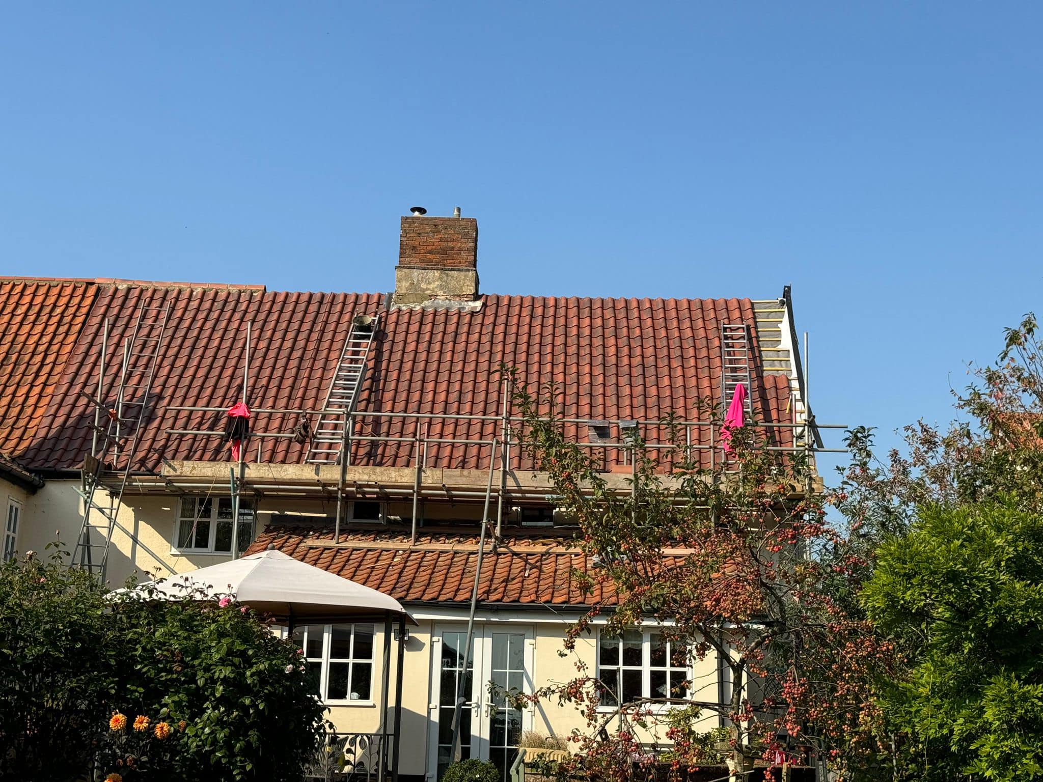 Professional roofers working on a property in London - KS Roof Master