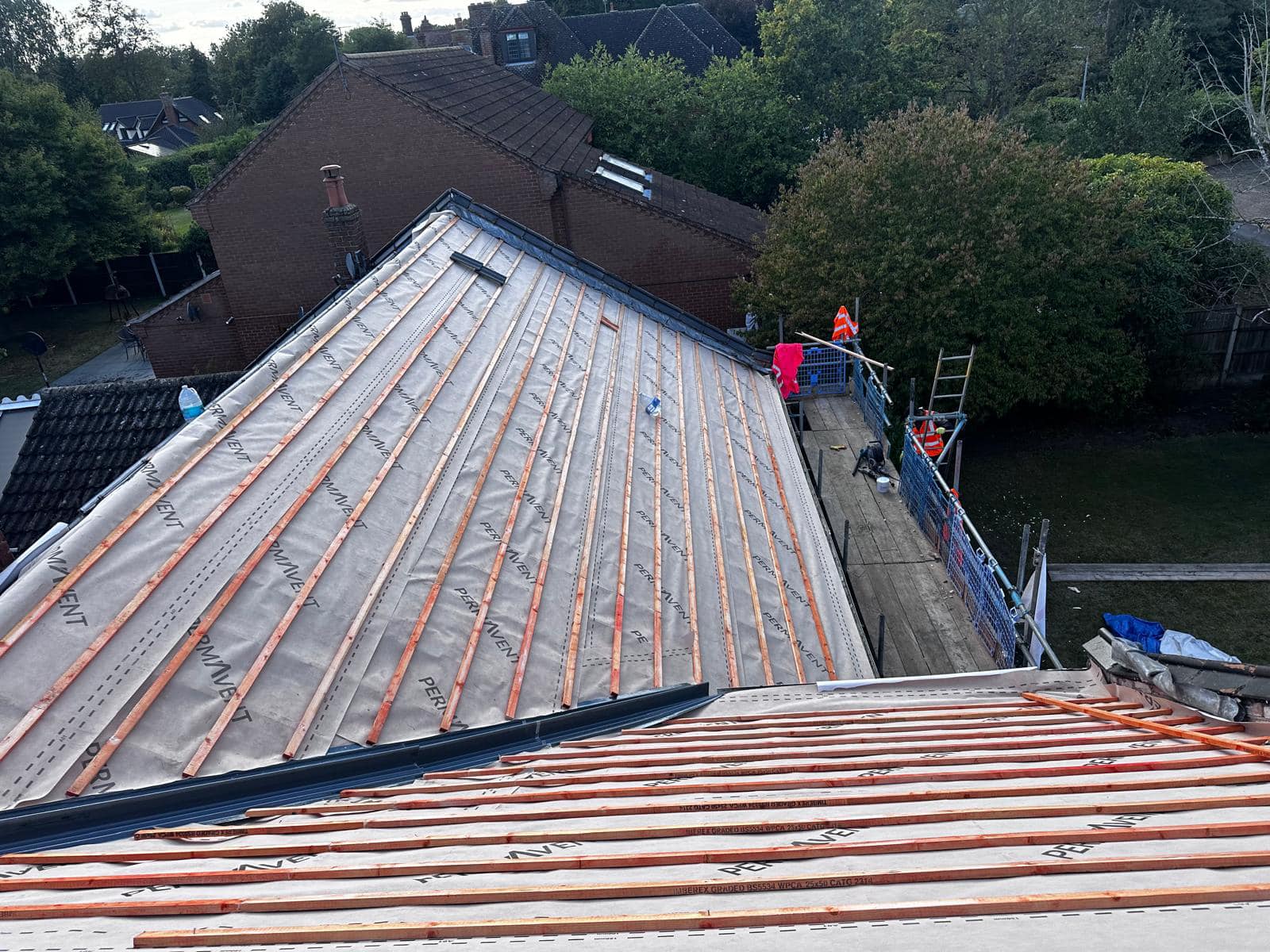Professional roofers working on a property in London - KS Roof Master