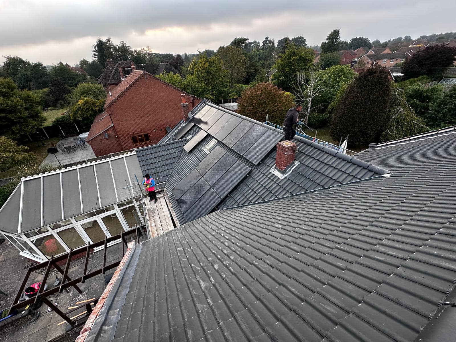 Professional roofers working on a property in London - KS Roof Master
