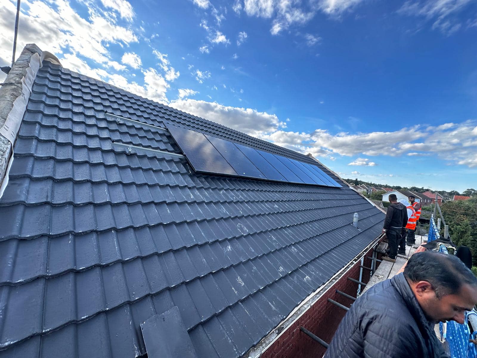 Professional roofers working on a property in London - KS Roof Master