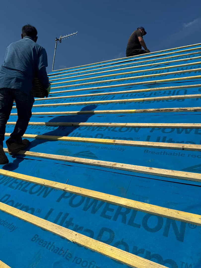 Professional roofers working on a property in London - KS Roof Master