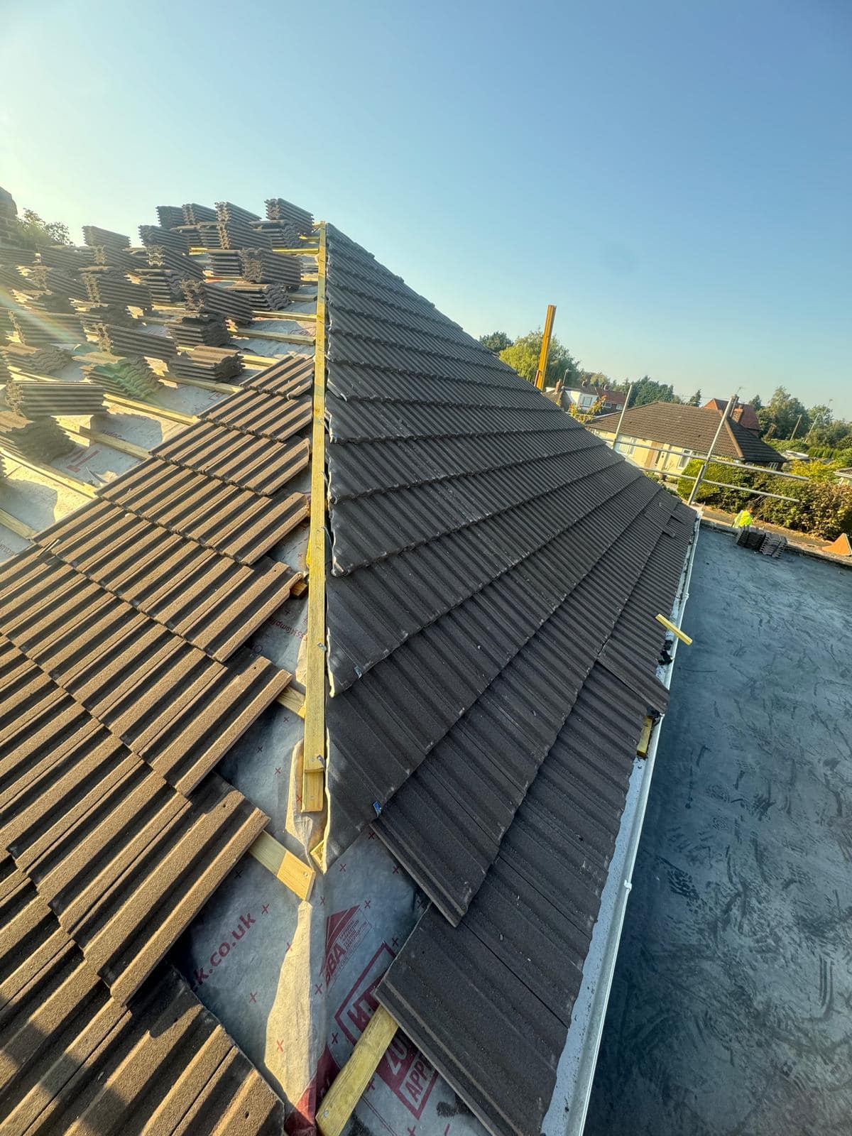 Professional roofers working on a property in London - KS Roof Master