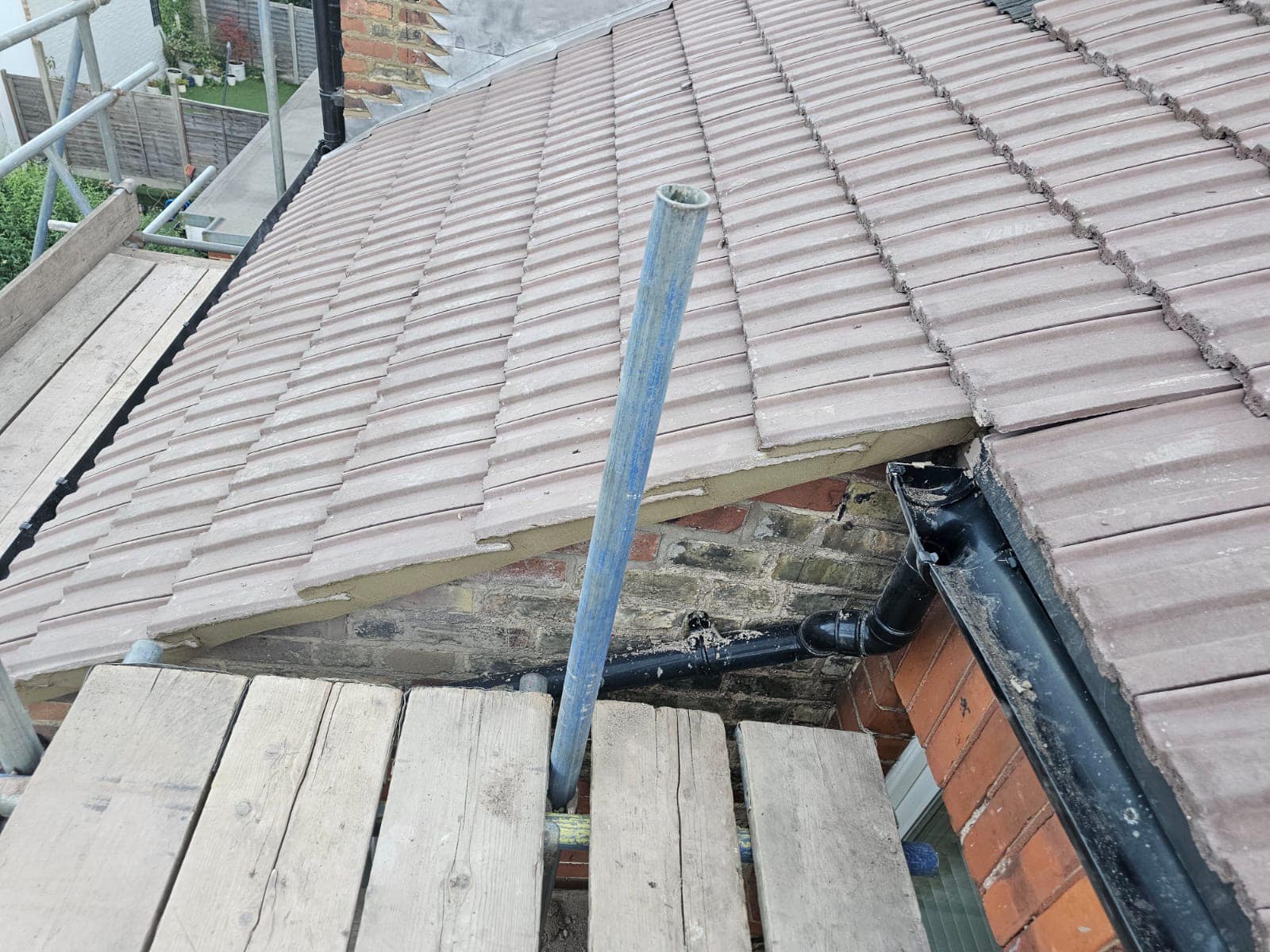 Professional roofers working on a property in London - KS Roof Master