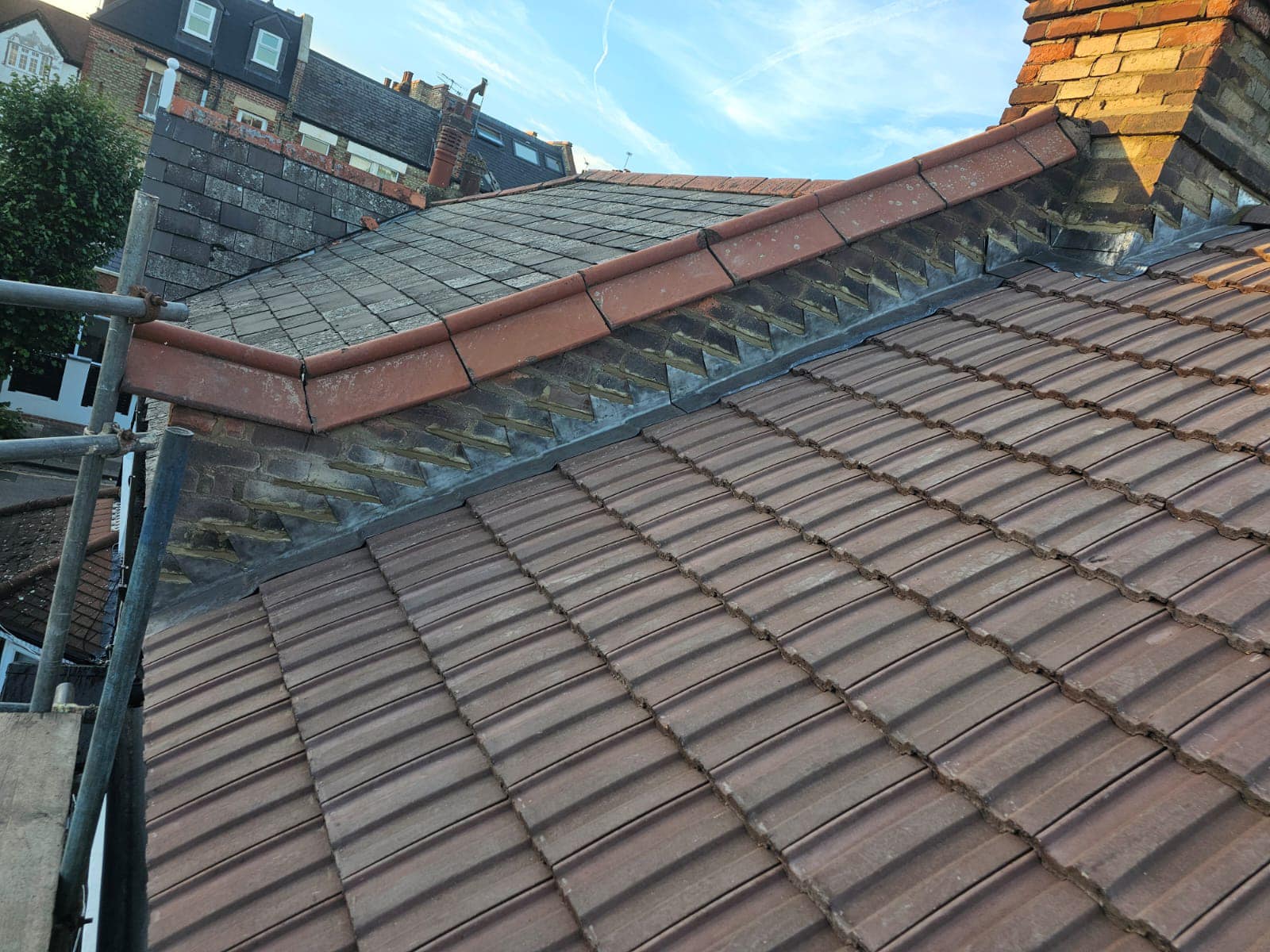 Professional roofers working on a property in London - KS Roof Master