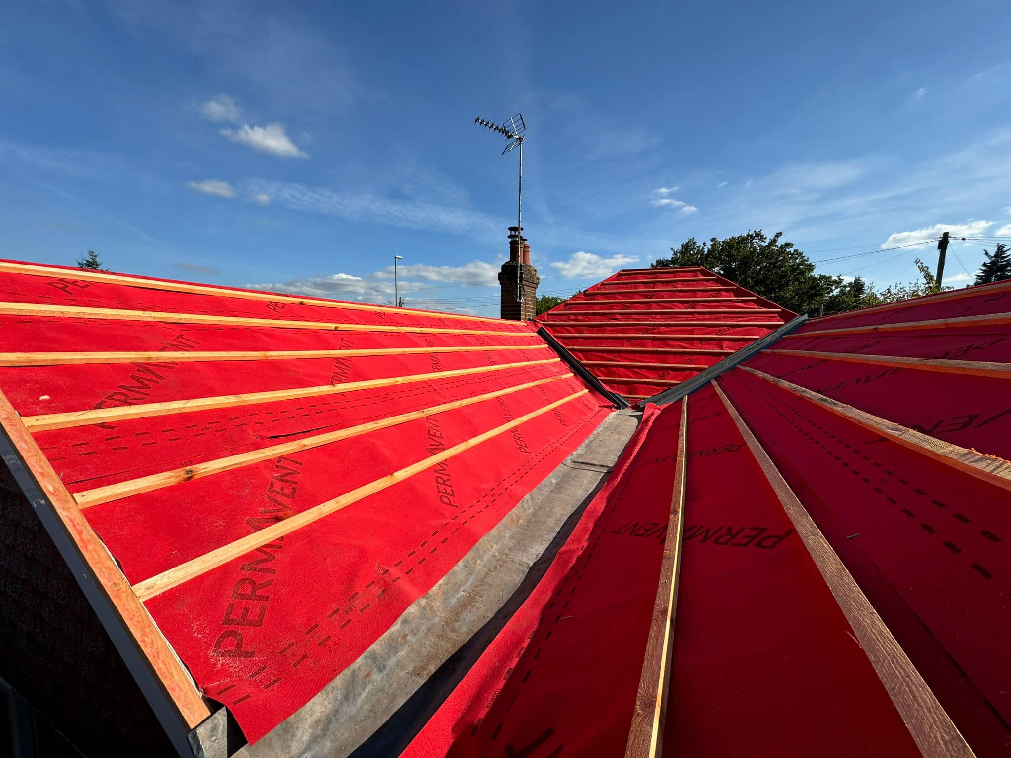 Professional roofers working on a property in London - KS Roof Master