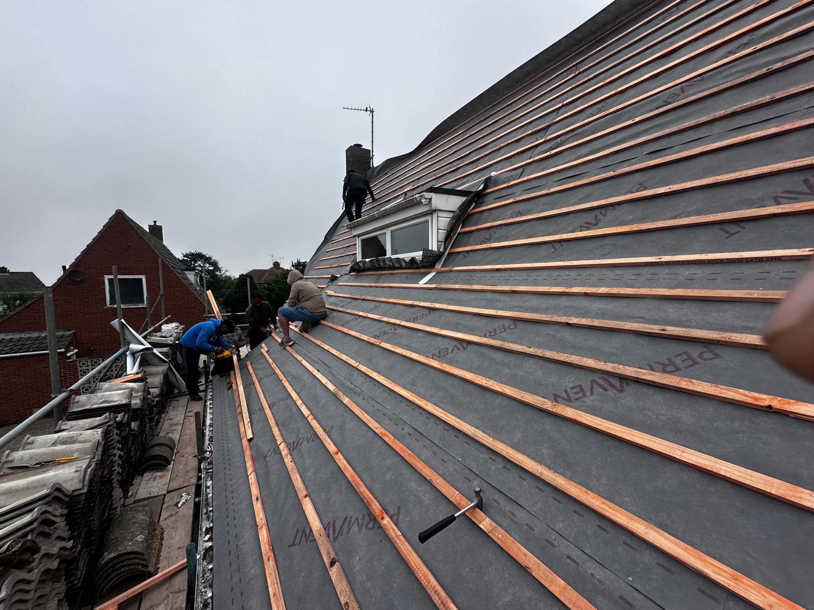 Professional roofers working on a property in London - KS Roof Master