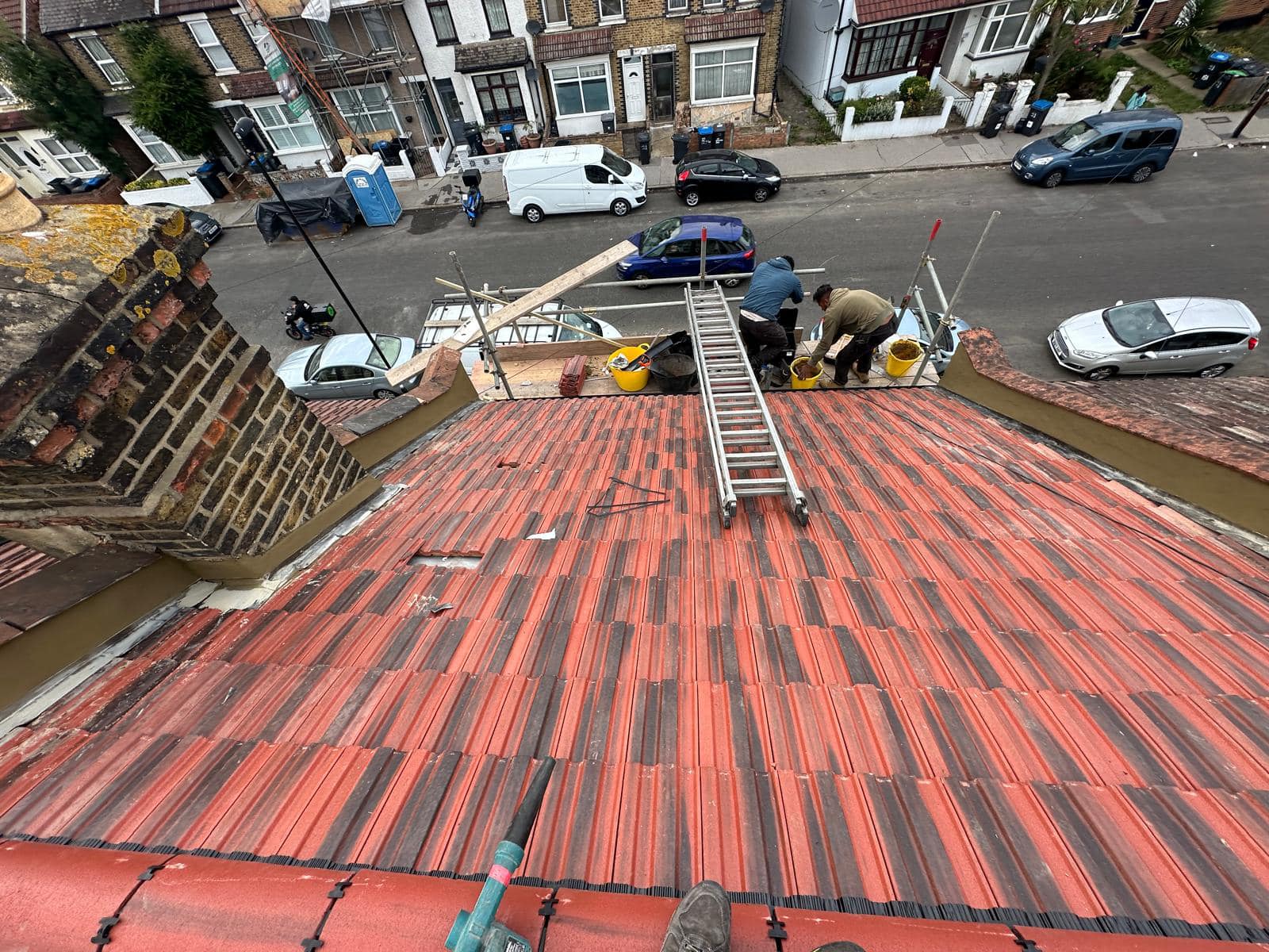 Professional roofers working on a property in London - KS Roof Master