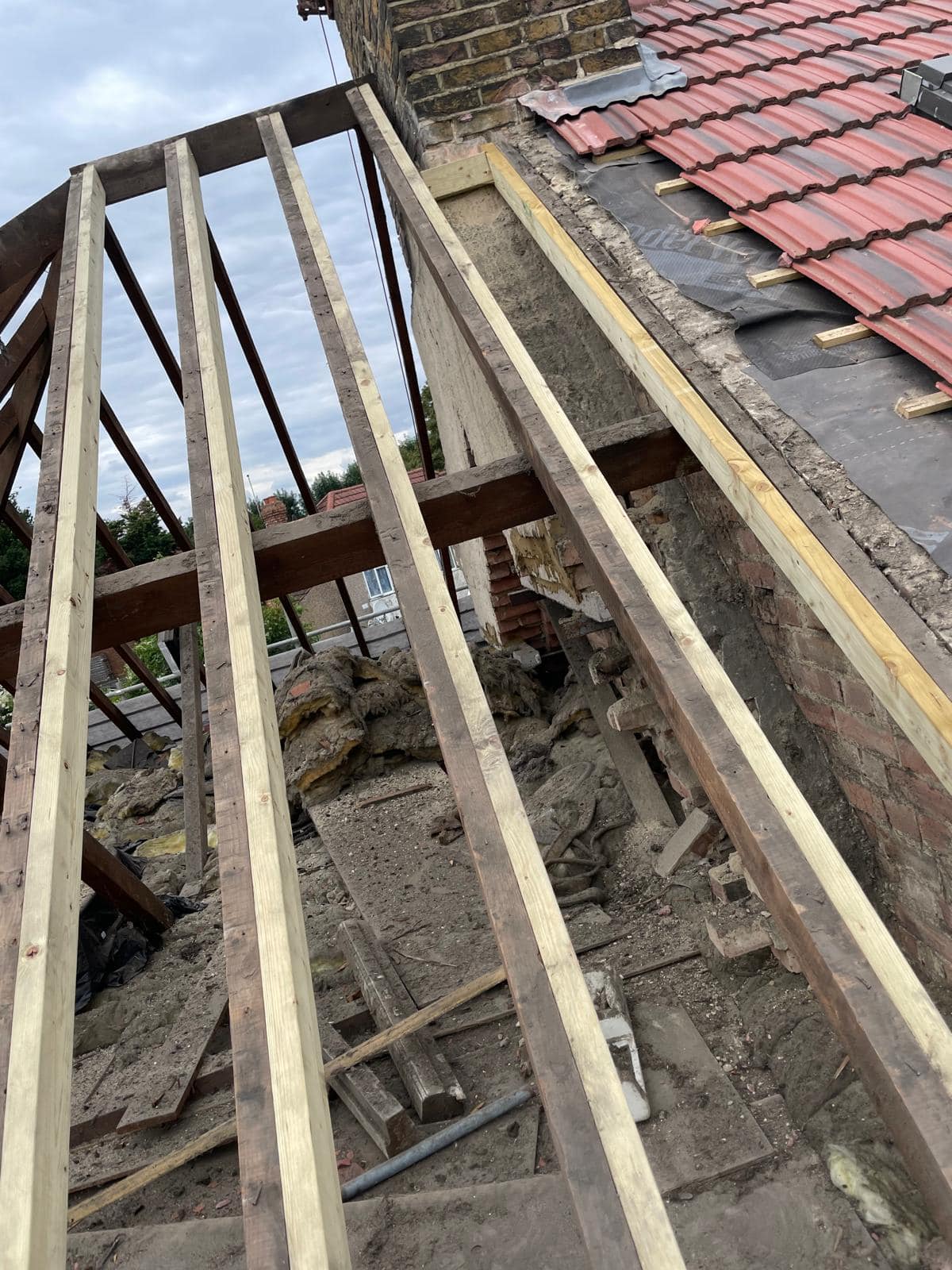 Professional roofers working on a property in London - KS Roof Master