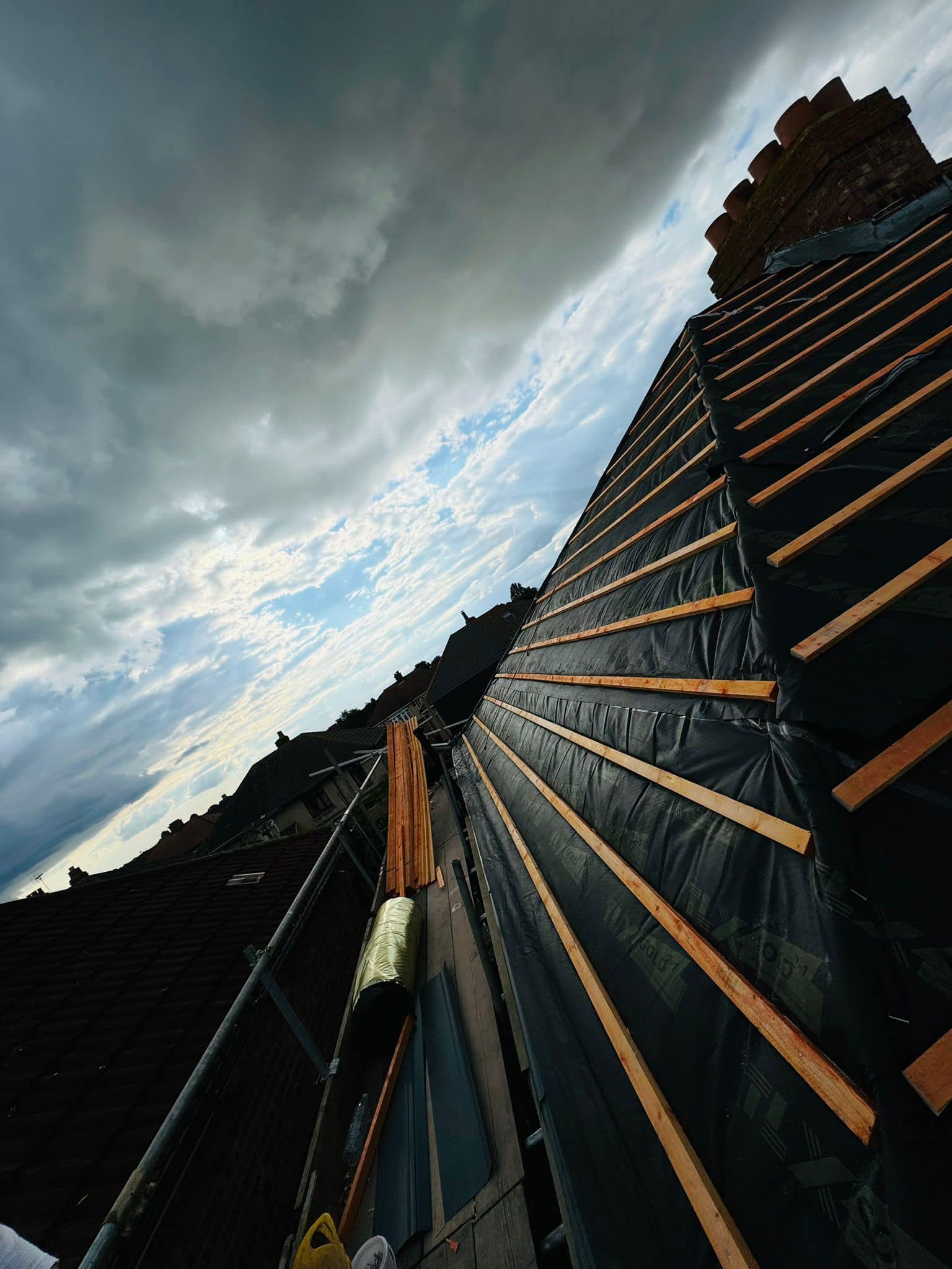 Professional roofers working on a property in London - KS Roof Master