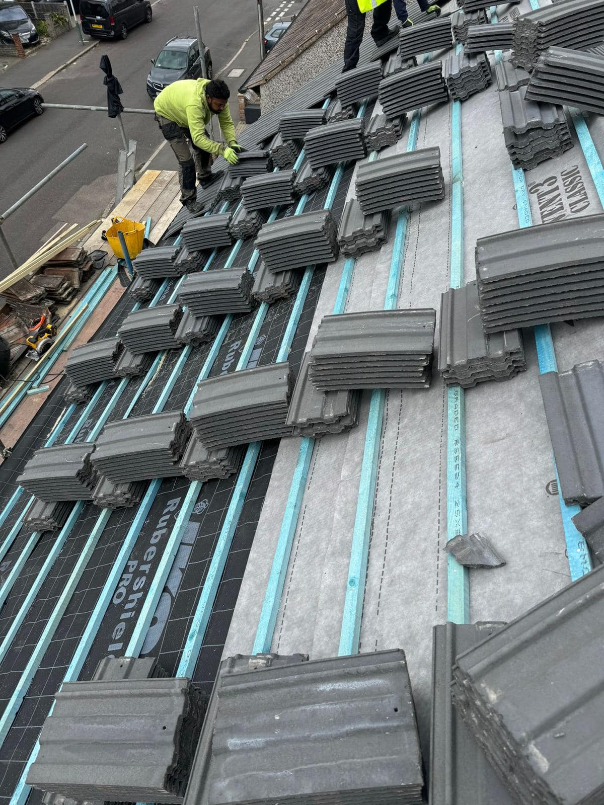 Professional roofers working on a property in London - KS Roof Master