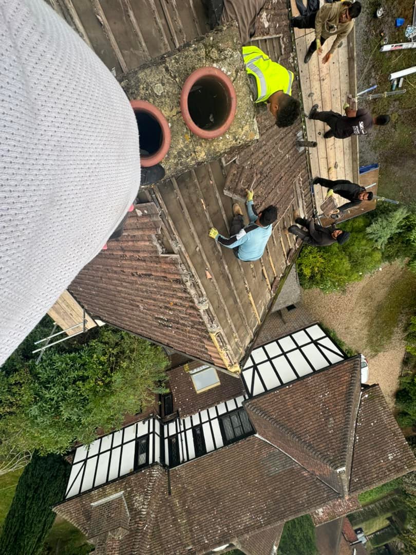 Professional roofers working on a property in London - KS Roof Master
