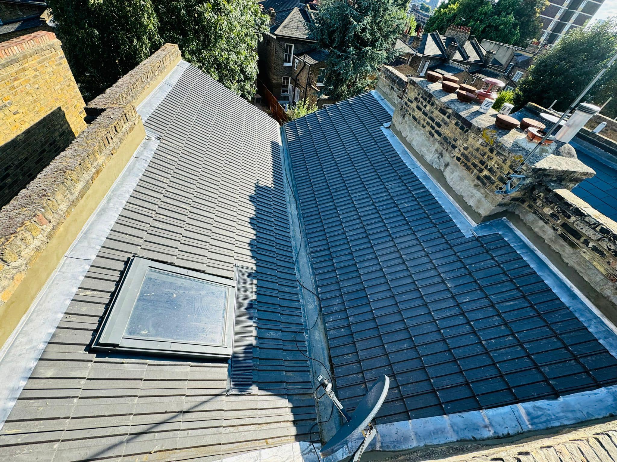 Professional roofers working on a property in London - KS Roof Master