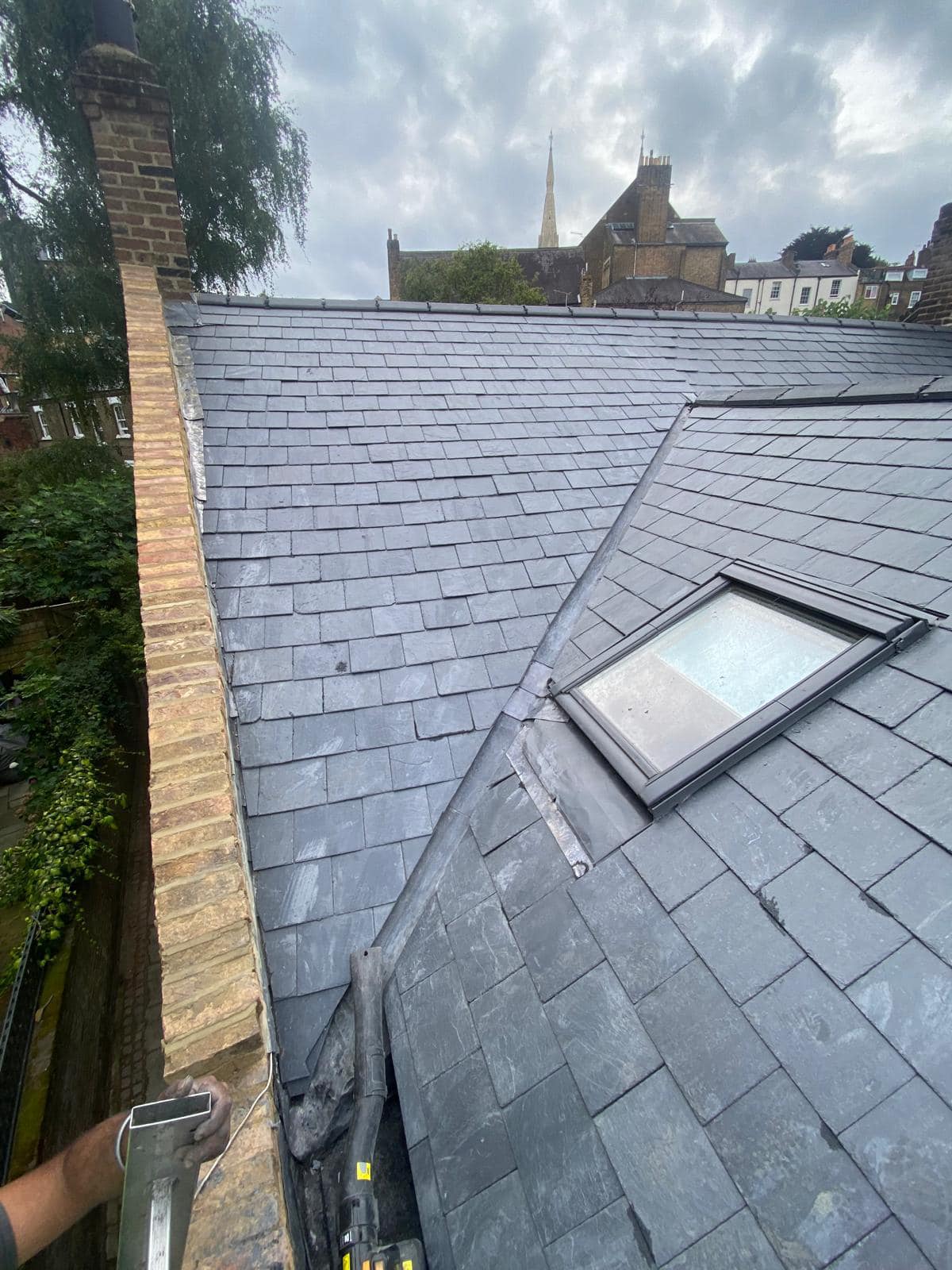 Professional roofers working on a property in London - KS Roof Master