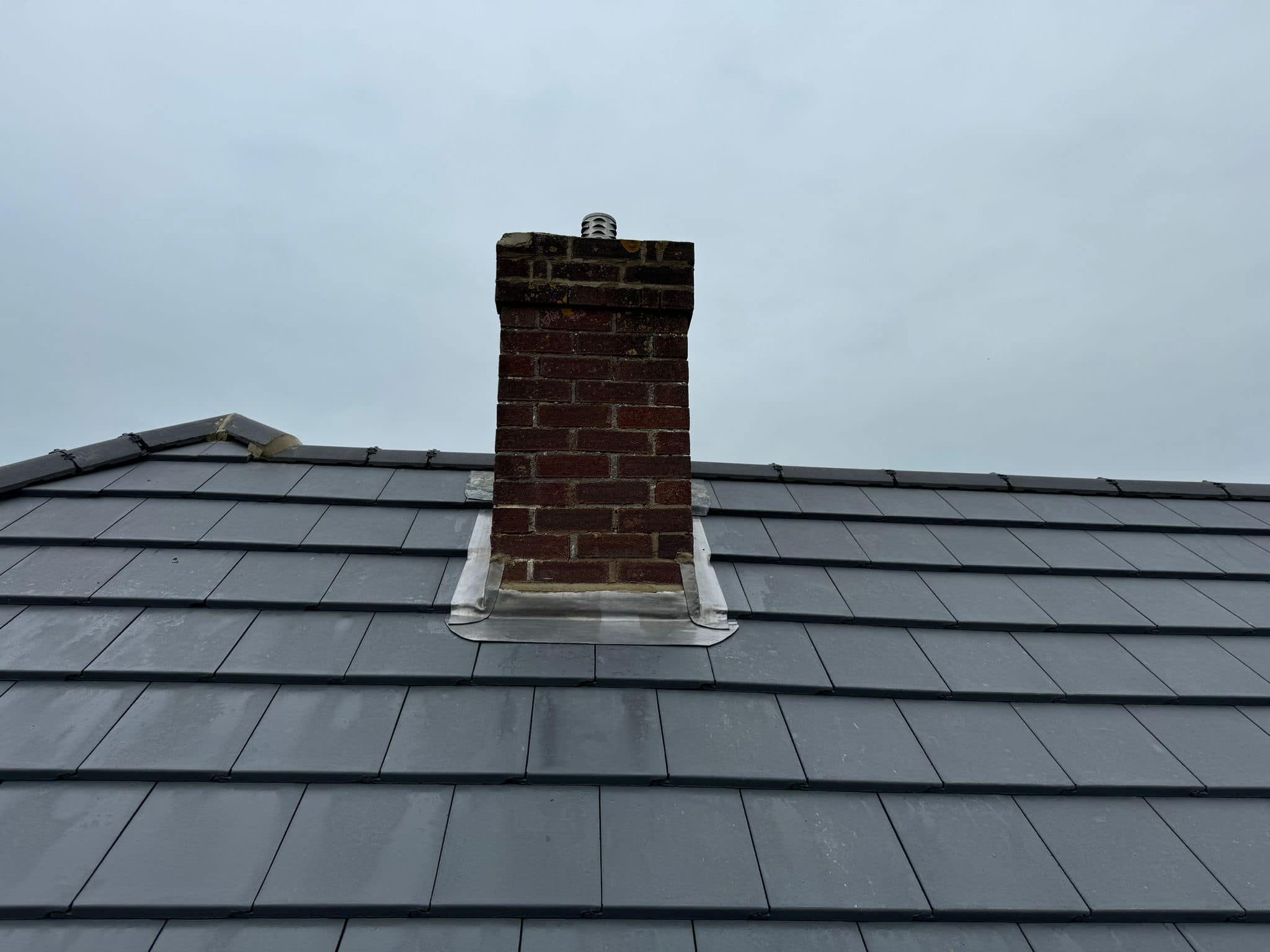 Professional roofers working on a property in London - KS Roof Master