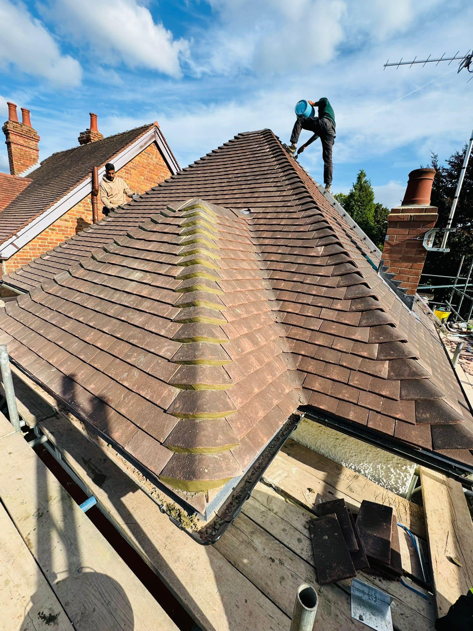 Professional roofers working on a property in London - KS Roof Master