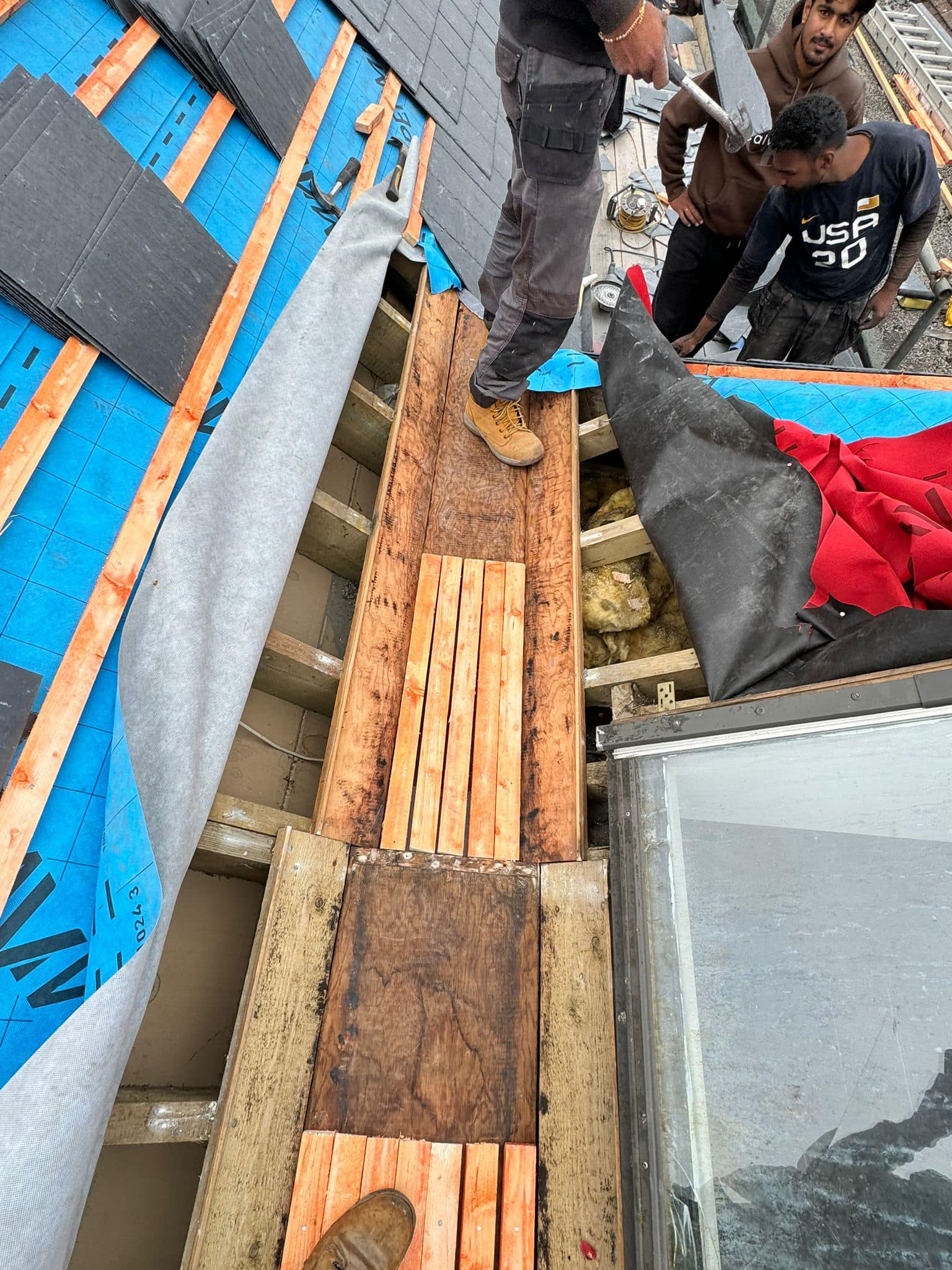 Professional roofers working on a property in London - KS Roof Master