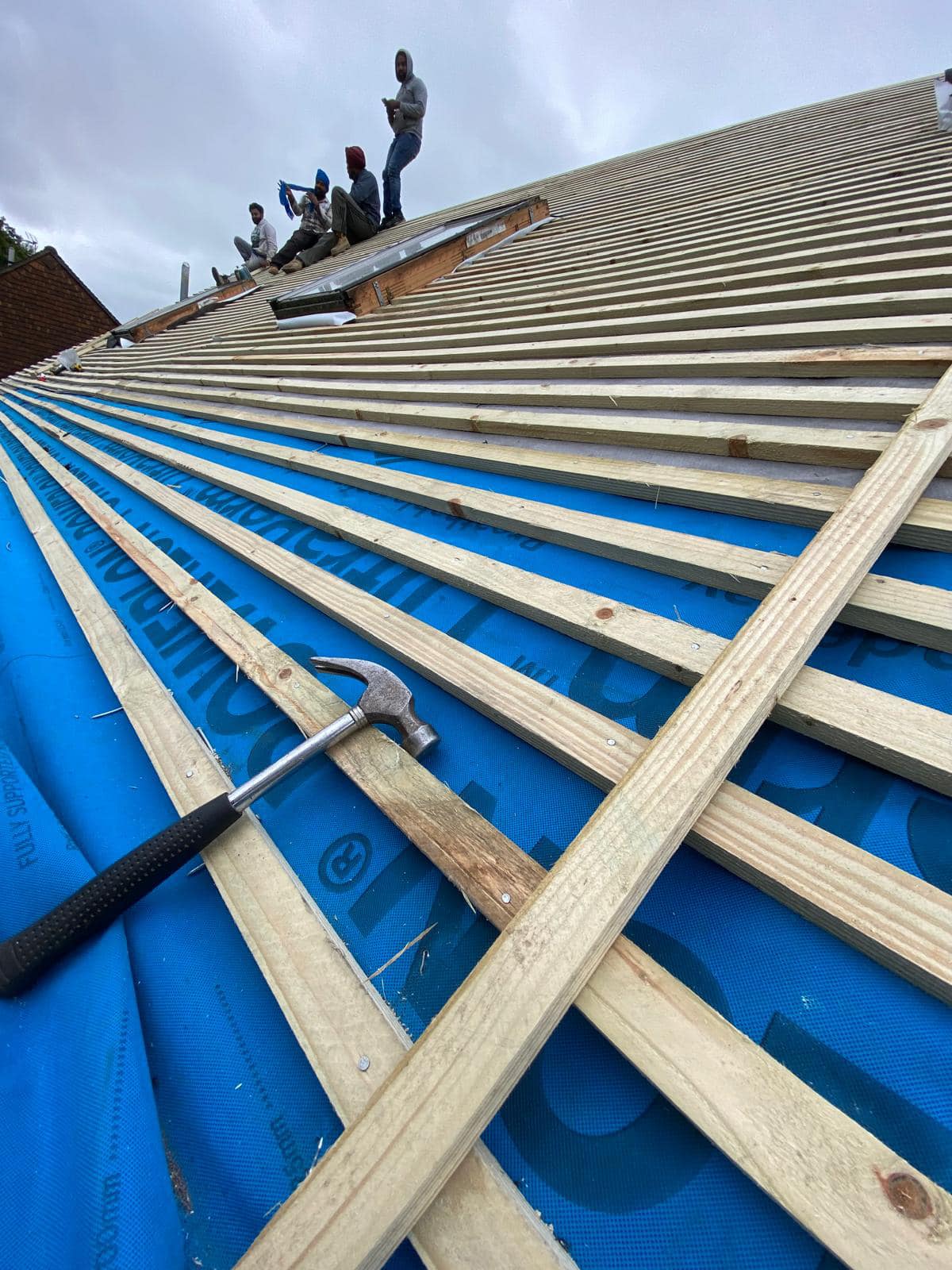 Professional roofers working on a property in London - KS Roof Master